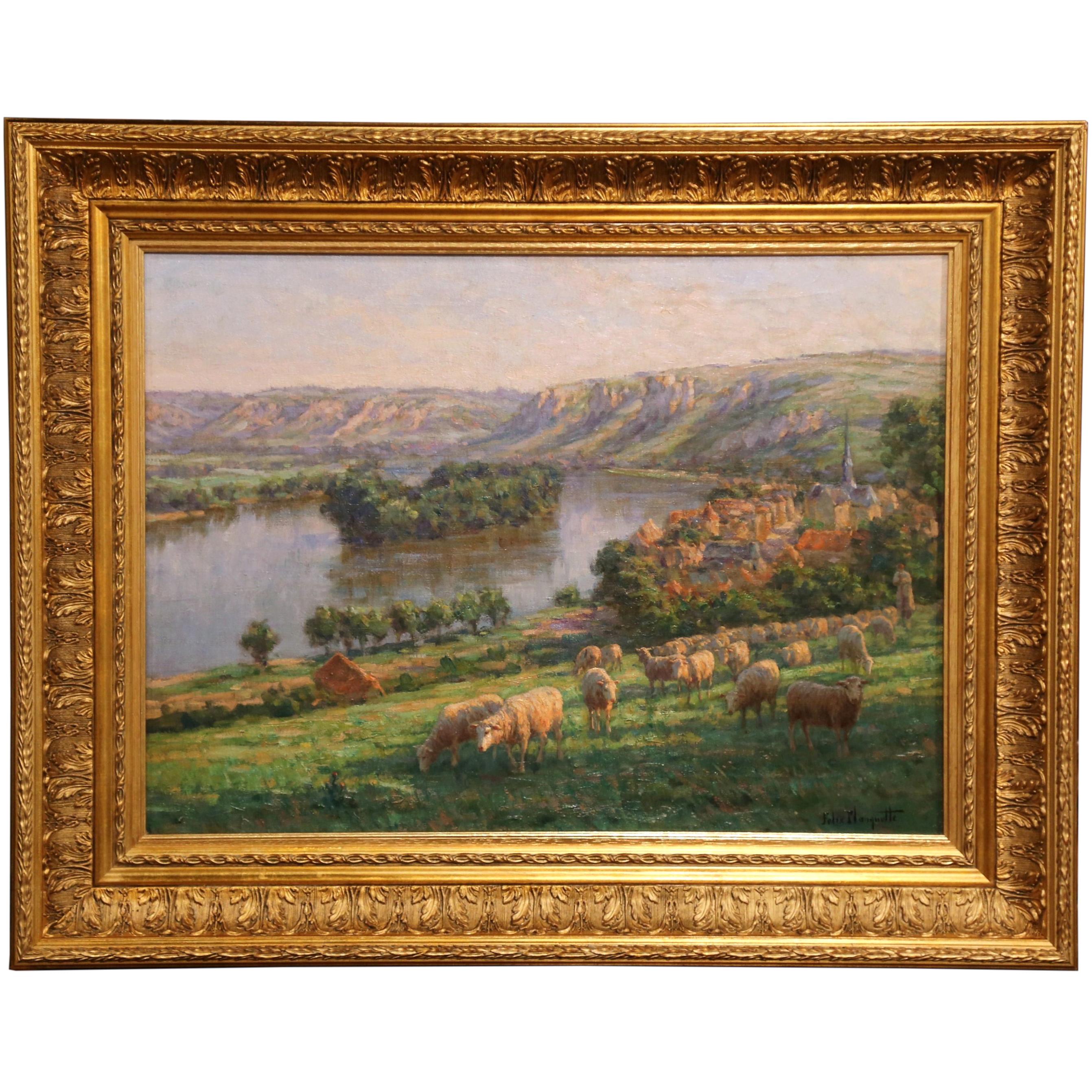 Add a beautiful view to your walls with this picturesque oil on canvas. The painting depicts a peaceful pastoral scene featuring a herd of sheep grazing in the foreground, and a rolling, countryside landscape in the background dotted with a village,