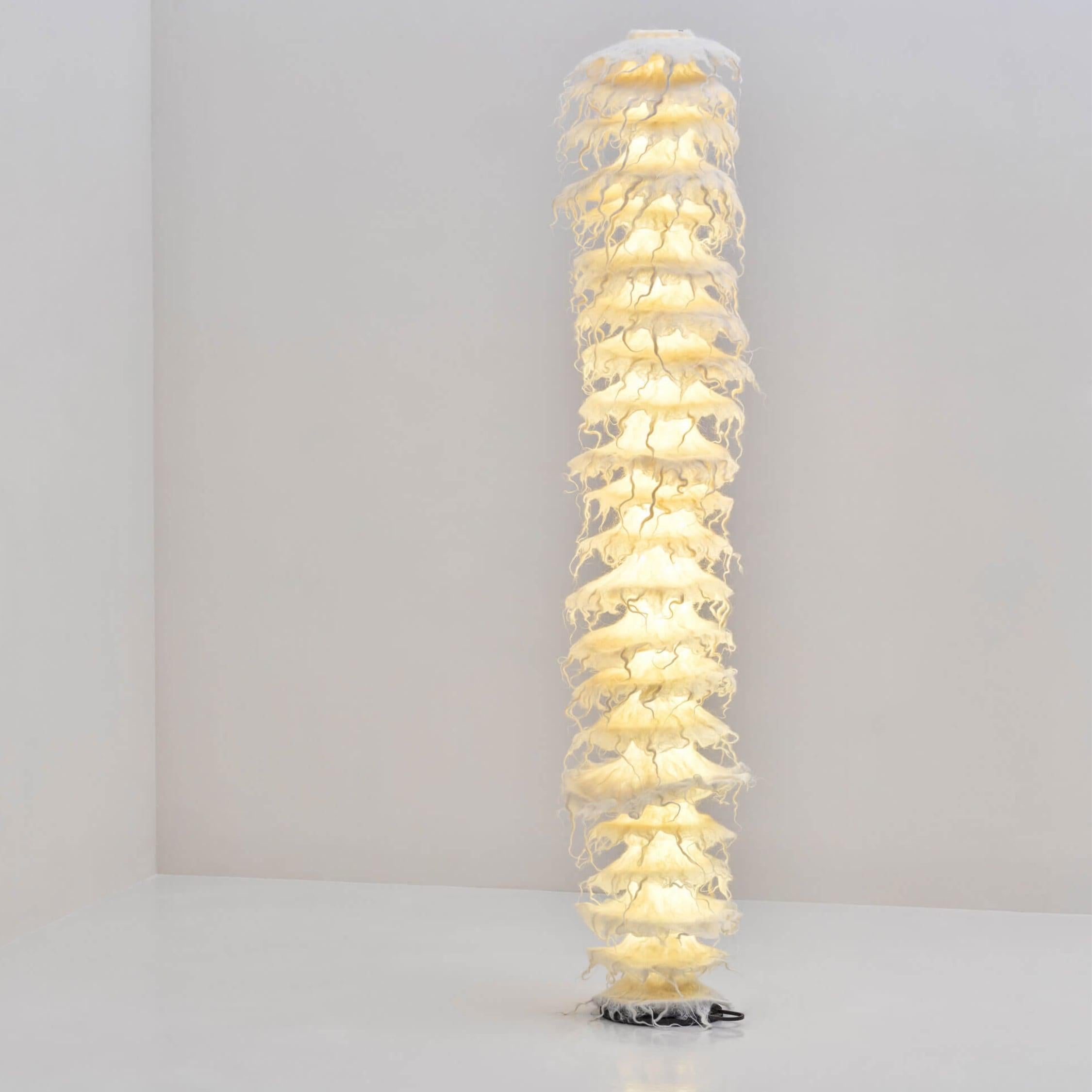 The Apaya Tinka floor lamp exemplifies Aqua Creations’ passion for textile research, and combines traditional felting techniques with modern lighting technology. The handcrafted wool sleeve is slipped over a transparent cylinder that evokes the