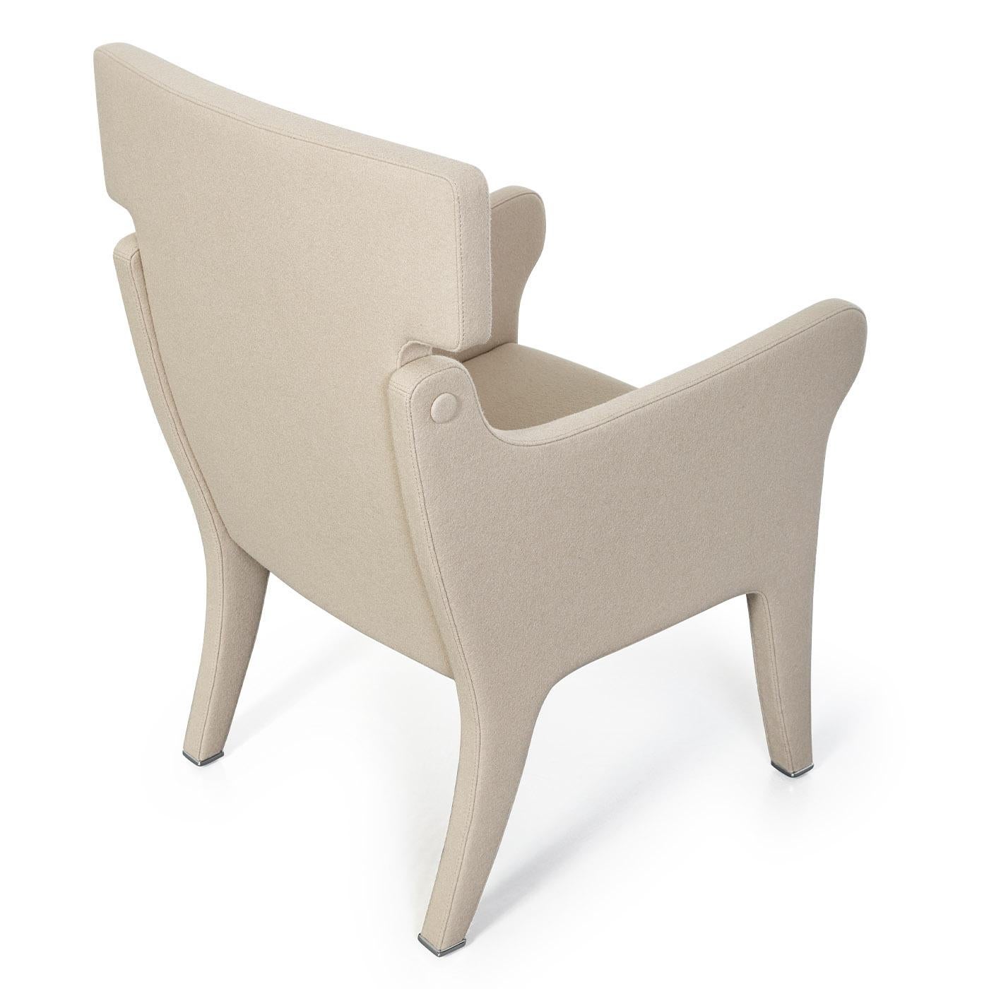 An exquisite design of iconic contemporary flair, this armchair by Ignazio Gardella is distinguished by a felt wool upholstery that covers its entire shape. Rendered in a cream-white tone also available in other hues, it features a rigid wooden