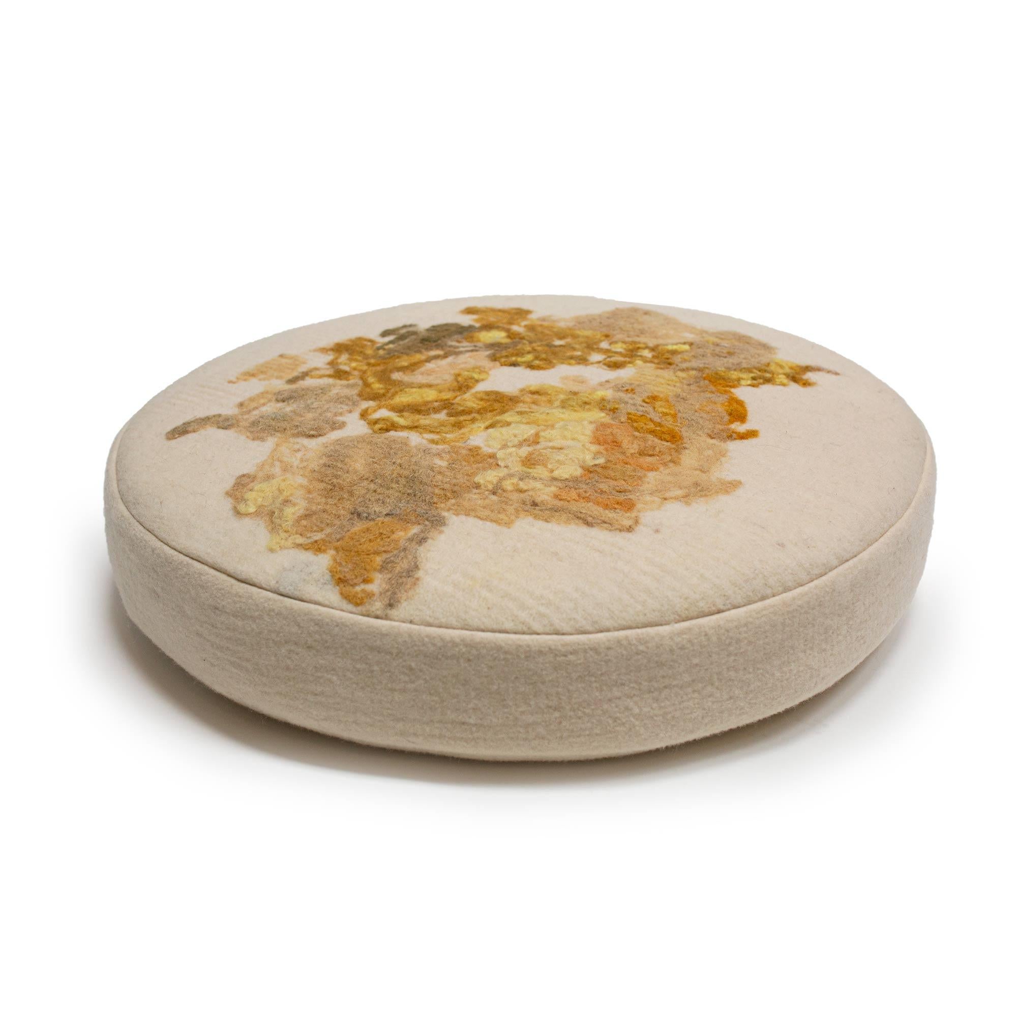 Felted wool round floor cushion, in turmeric-dye medallion yellow felted from local, fiber shed wool in a creamy, natural background, our indigo and green apple dyes are nature-made and part of our Botanical Collection.
Raw fleeces are 