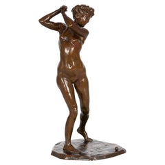 Sculpture française en bronze ancien représentant une golfeuse féminine (1909), par Jacques Loysel