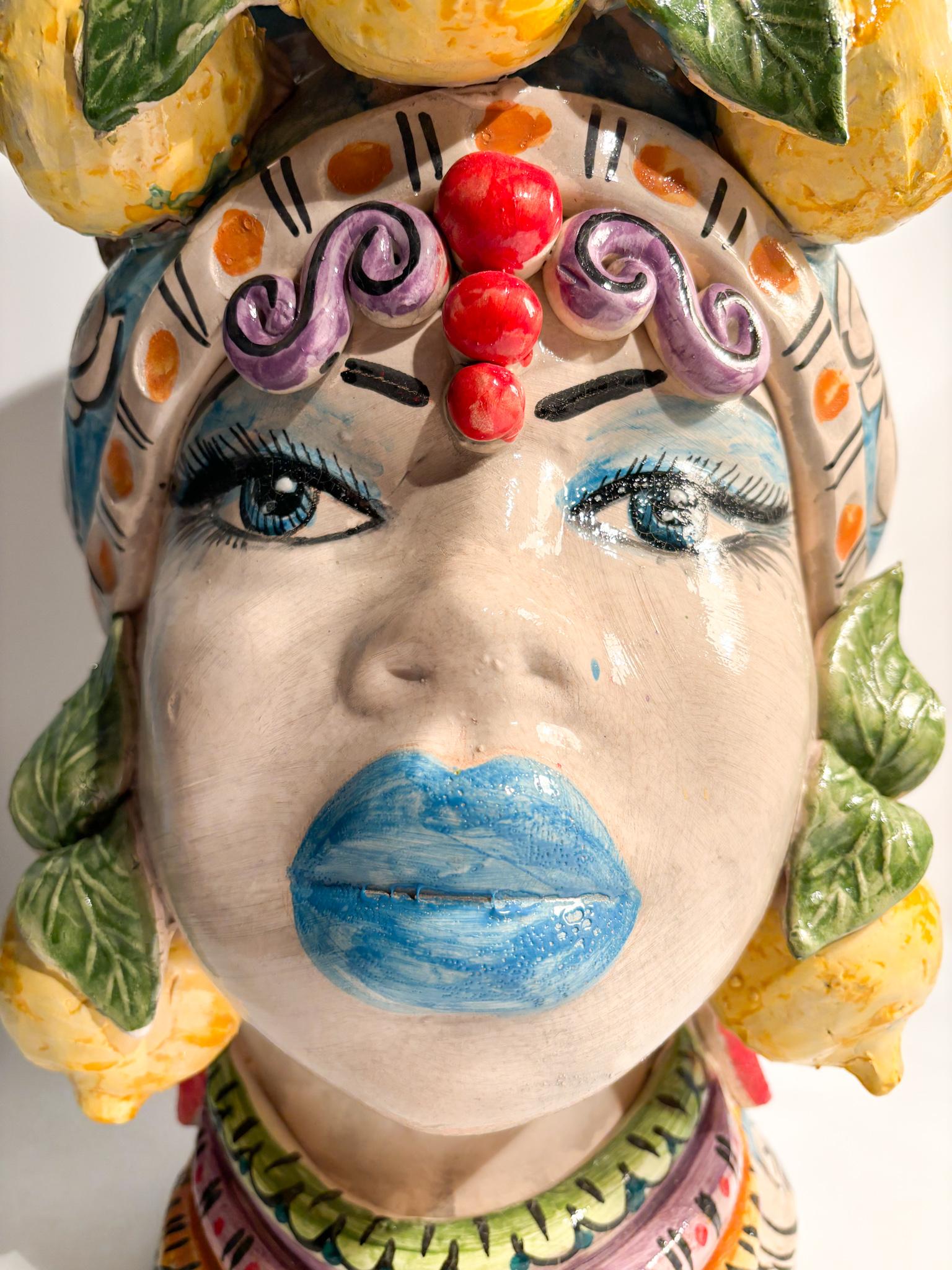 Moor's head of Caltagirone of a female figure with lemons, made by Ceramiche Germano in the 1990s

Ø 26 cm h 43 cm

Ceramiche Germano is a ceramic company based in Caltagirone, Sicily, Italy. The company was founded in 1967 by Sebastiano Germano and