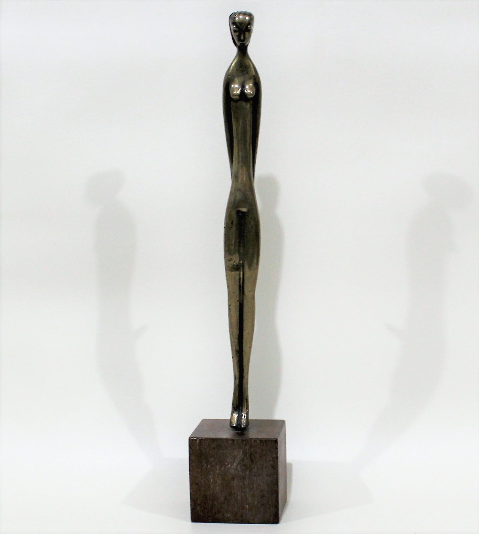 Female nude modernist sculpture in the style of Alberto Giacometti.