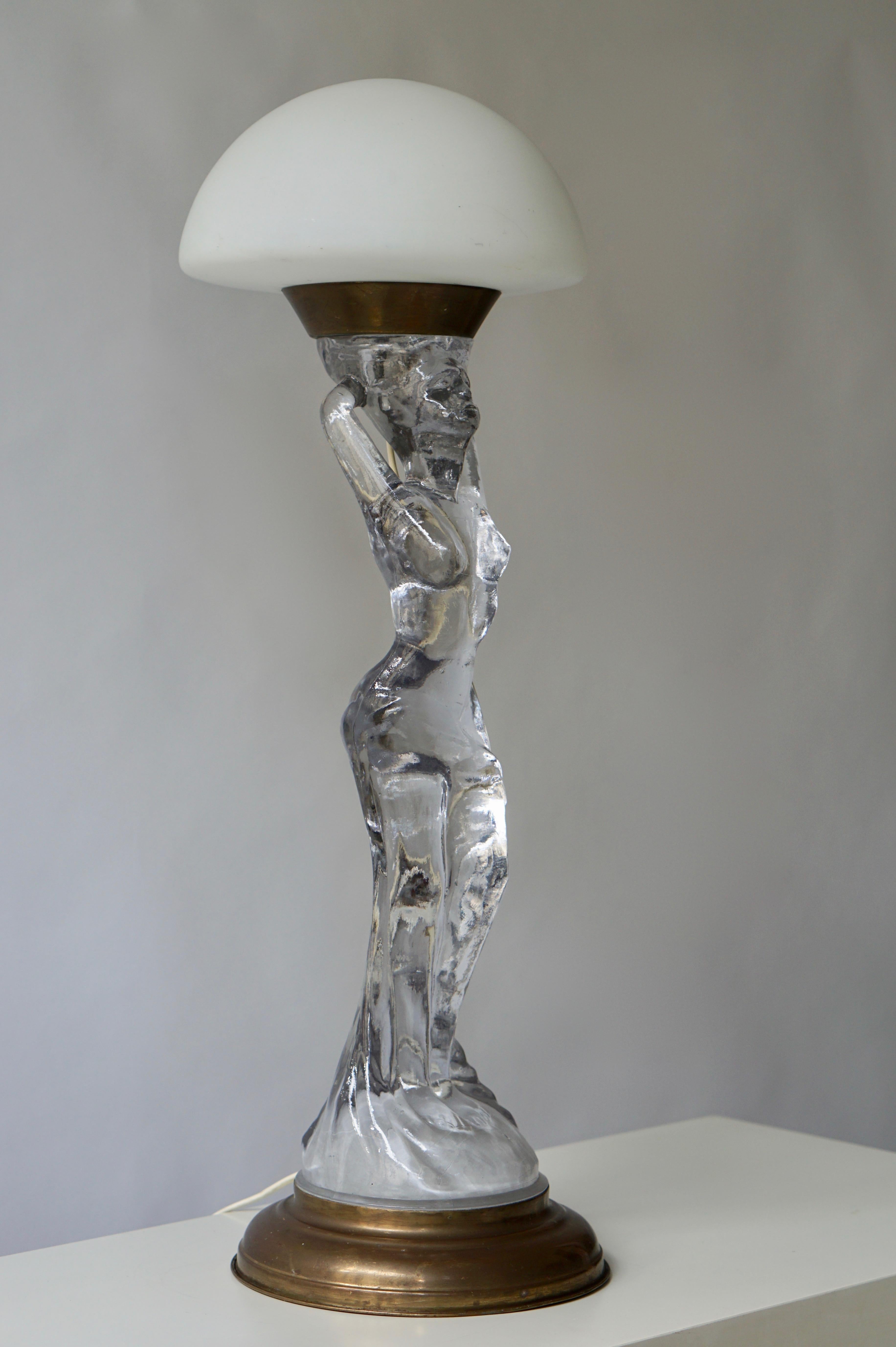 Wonderful nude table lamp in glass and brass.
Height 72 cm.
Diameter 24 cm.