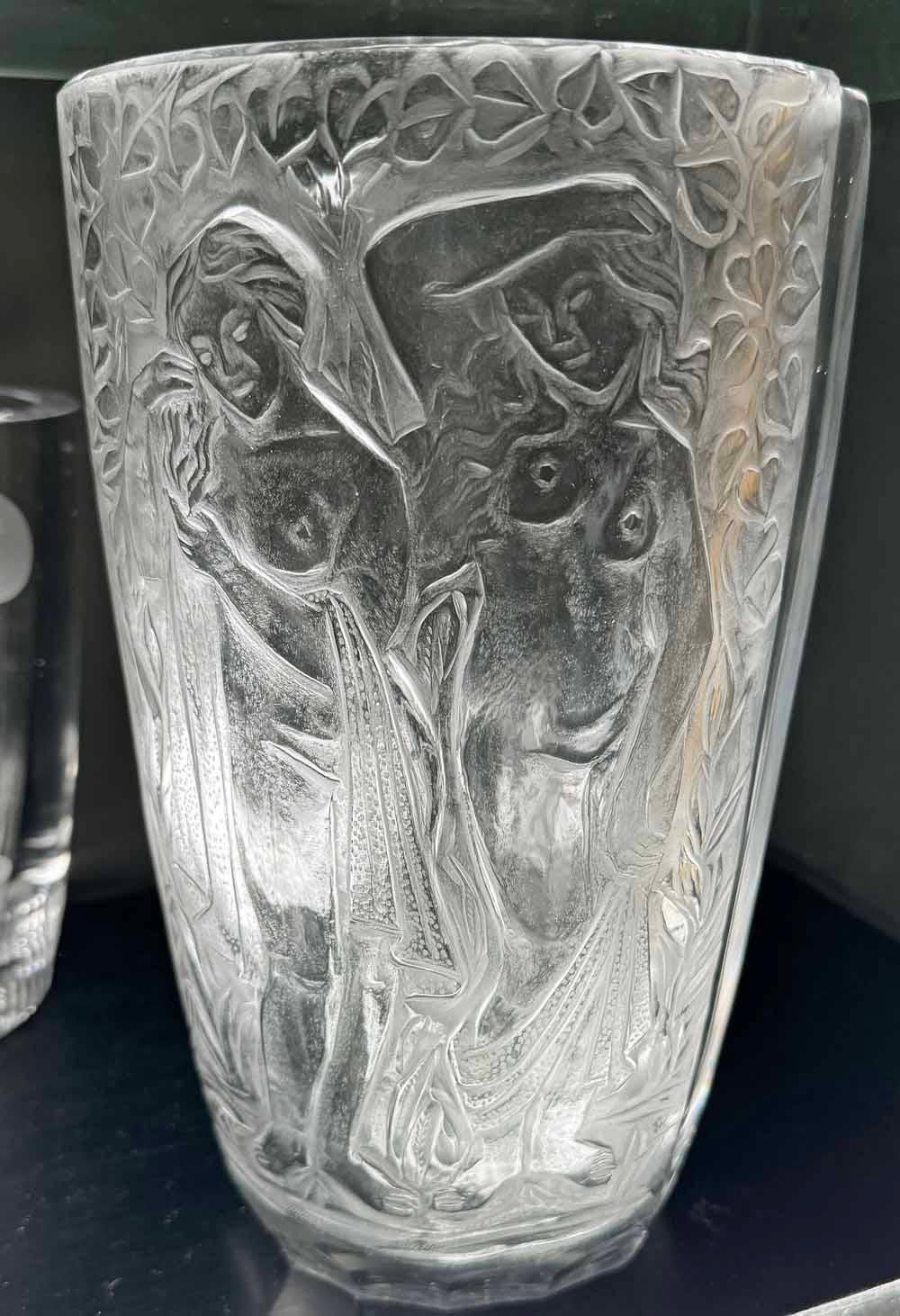 Deeply engraved -- not molded -- in gorgeous glass crystal, this Art Deco vase depicts two nude female figures under a canopy of ivy. The glass sculpting is impressive and shows the hand of a master, probably from Czechoslovakia during its