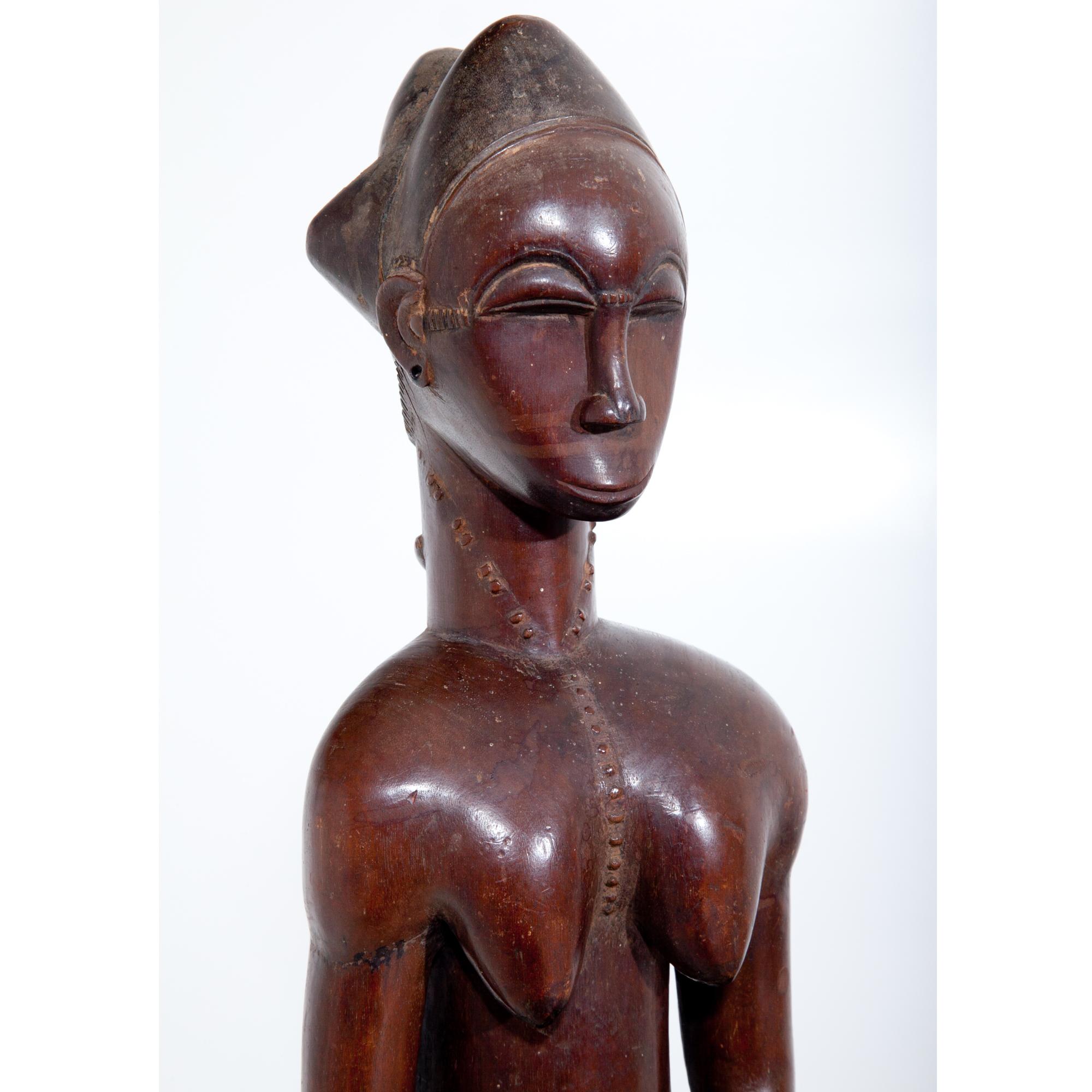 Wood Female Sculpture of the Baule, Côte d’Ivoire, circa 1900-1920