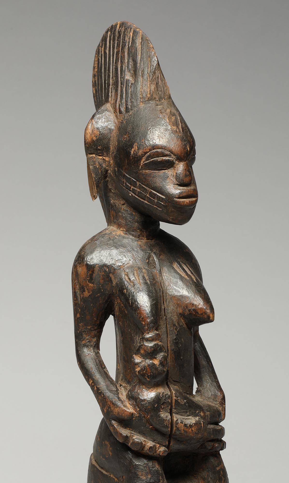 Ivorian Female Senufo Wood Maternity Figure with Baby Seated on Stool nursing For Sale