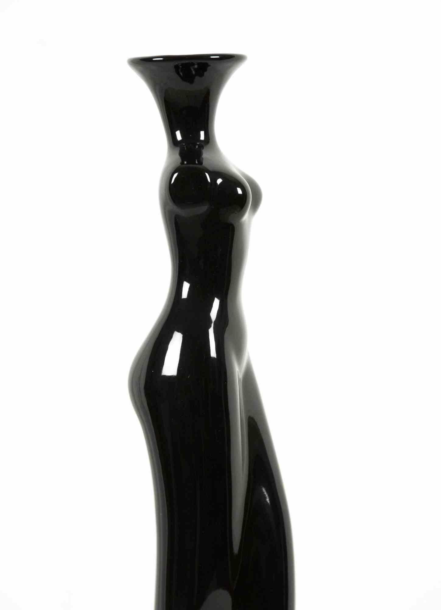 Female shape vase is an original decorative object realized in the 1970s.

Made in Italy.

Original Black Ceramics.

The vase has a female sinuous body shape and has been realized with a very bright ceramics.

Excellent conditions.
