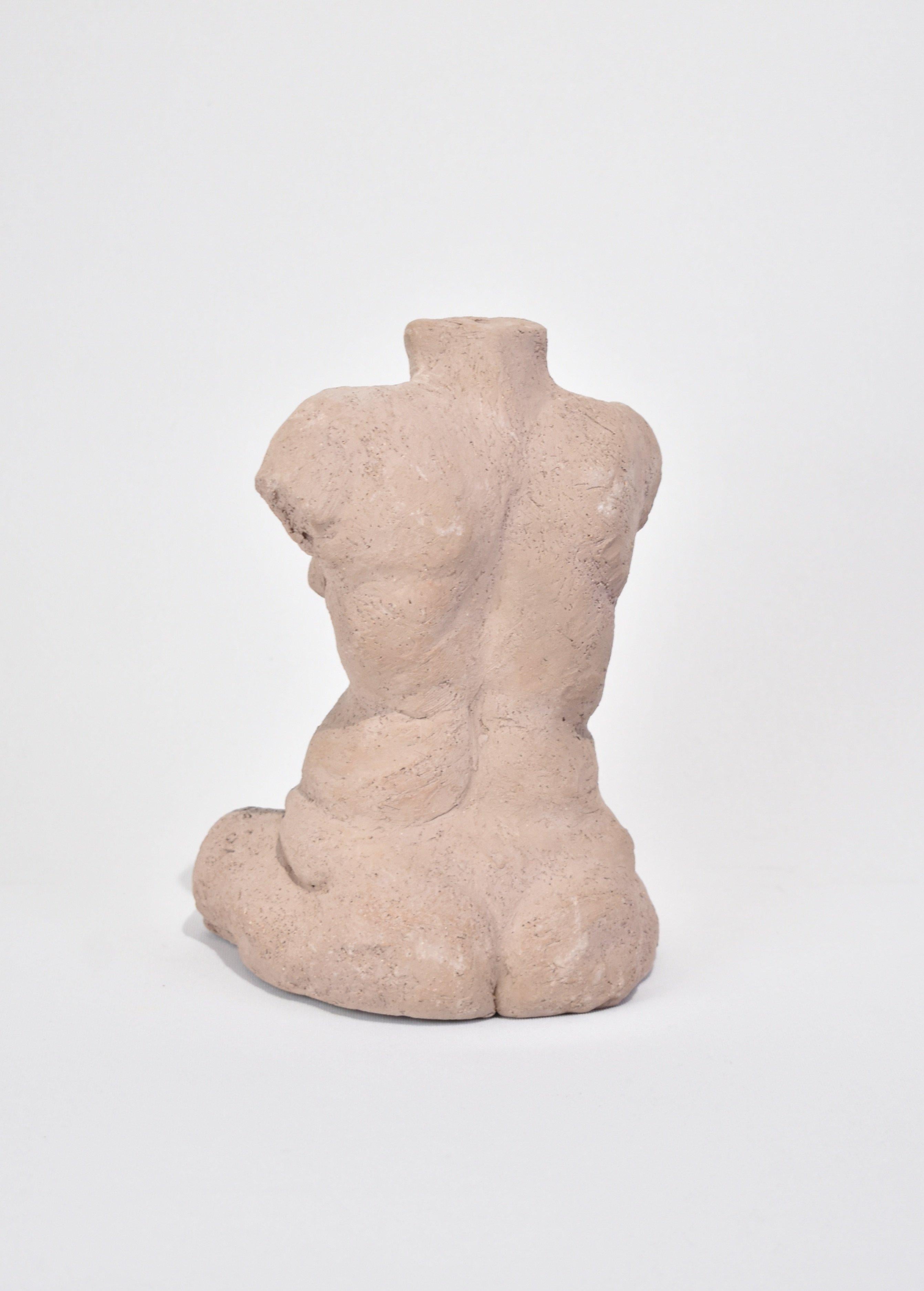 Handmade female torso sculpture in light pink terracotta. Signed Horence '01.