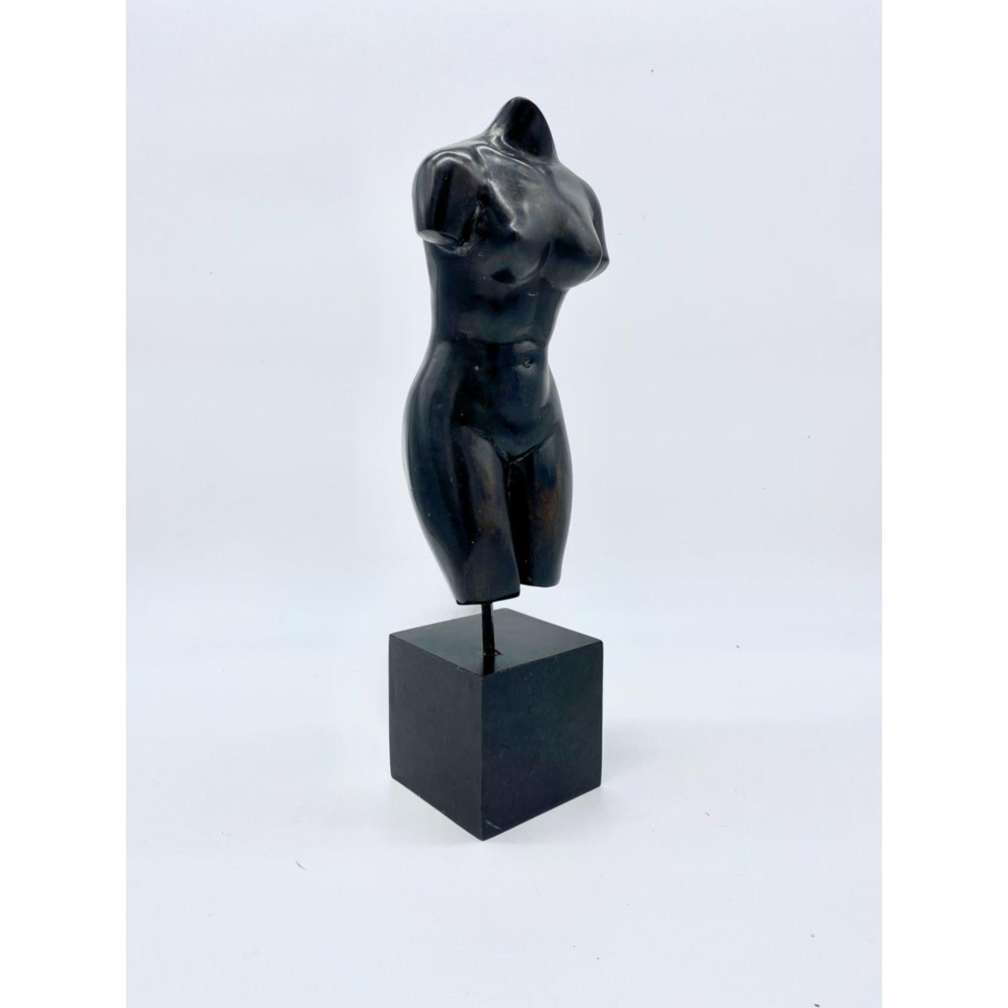 Mid-century cast stone sculpture of a female torso on a wood cube plinth.

Additional Information:
Materials:Stone, Wood
Color: Black
Style: Art Deco, Hollywood Regency, Neoclassical
Art Sublect: Figure
Period: 1960s
Item Type: Vintage, Antique or