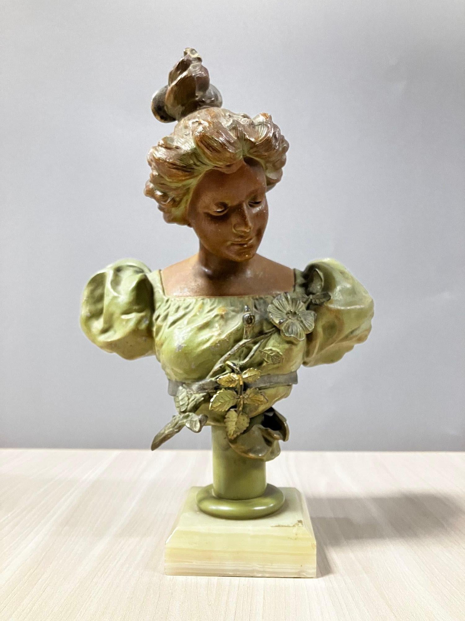 Late Victorian circa 1890 bronze female bust featuring a European-dressed woman in a summer dress with a sunflower fixed to a marble base. 
 
France, 1890.