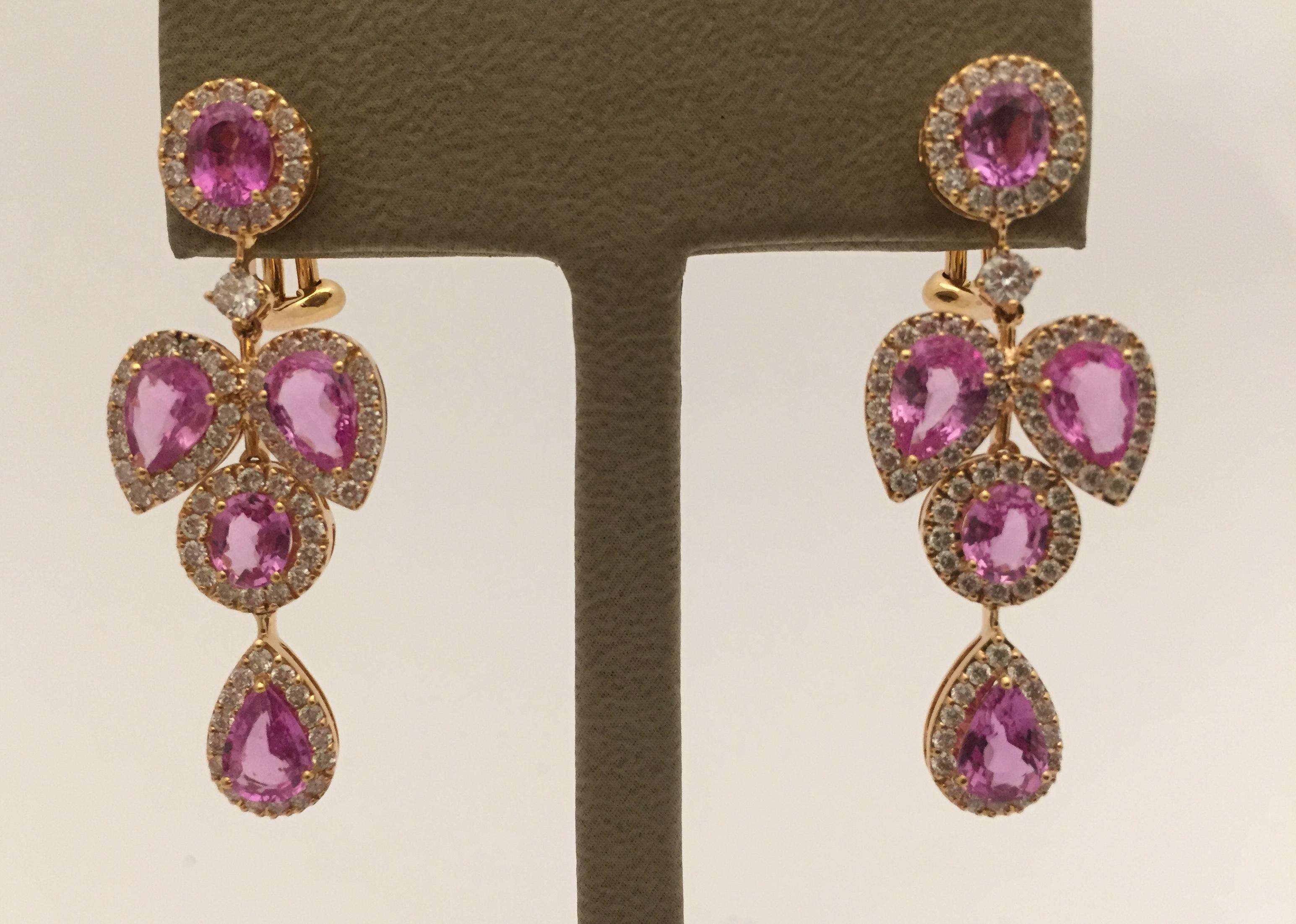 Elegant, and opulent, these wonderful chandelier earrings feature 10 vibrant, pink sapphires of total 6.96 ct. They are surrounded with 154 diamonds, G color, vs clarity of total 1.78 ct.