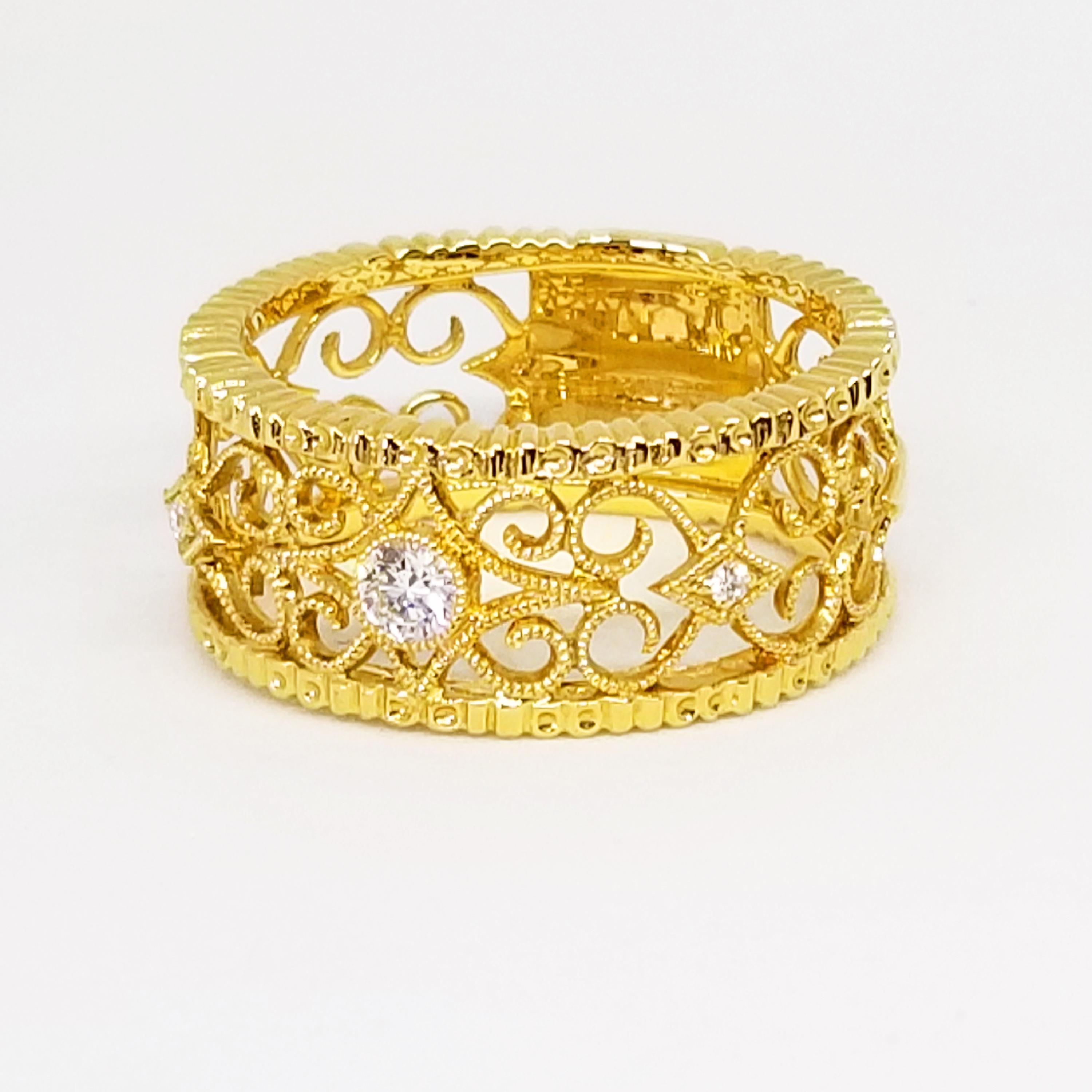 This Feminine Filigree Eternity Ring features three Round Brilliant Diamonds of 0.12 Carat total weight, G-H Color and Si1 Clarity. The center Diamond is bezel set and the Diamond on either side is bead set. The Intricate Band features an open work,
