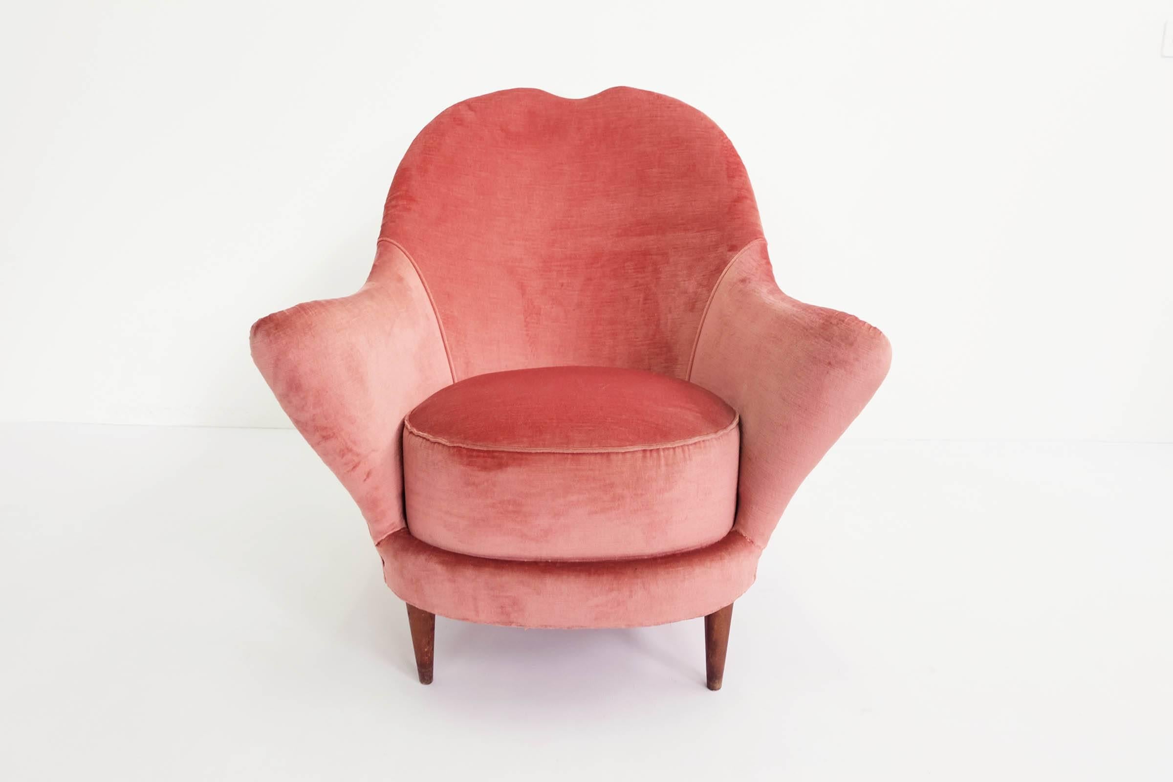 Newly reupholstered armchair in pale rose velvet.