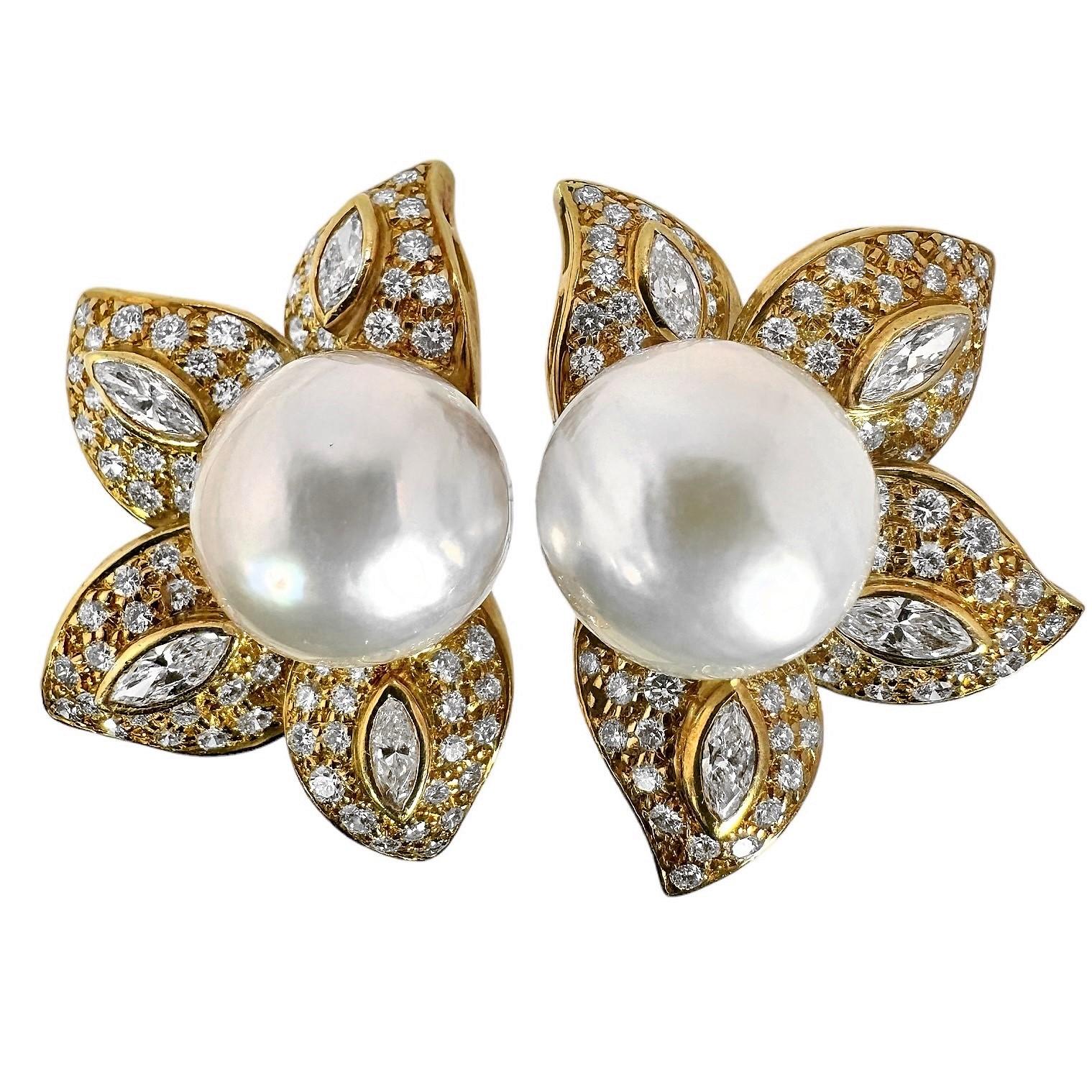 This stylish and feminine pair of Mid-20th Century floral motif earrings are set very liberally with brilliant cut and marquise diamonds having a total approximate weight of 4.00ct and an overall quality of G color and VS1 clarity. There is a