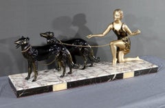 Woman with Greyhounds in Patinated Metal, sculpture Art Deco – 1930