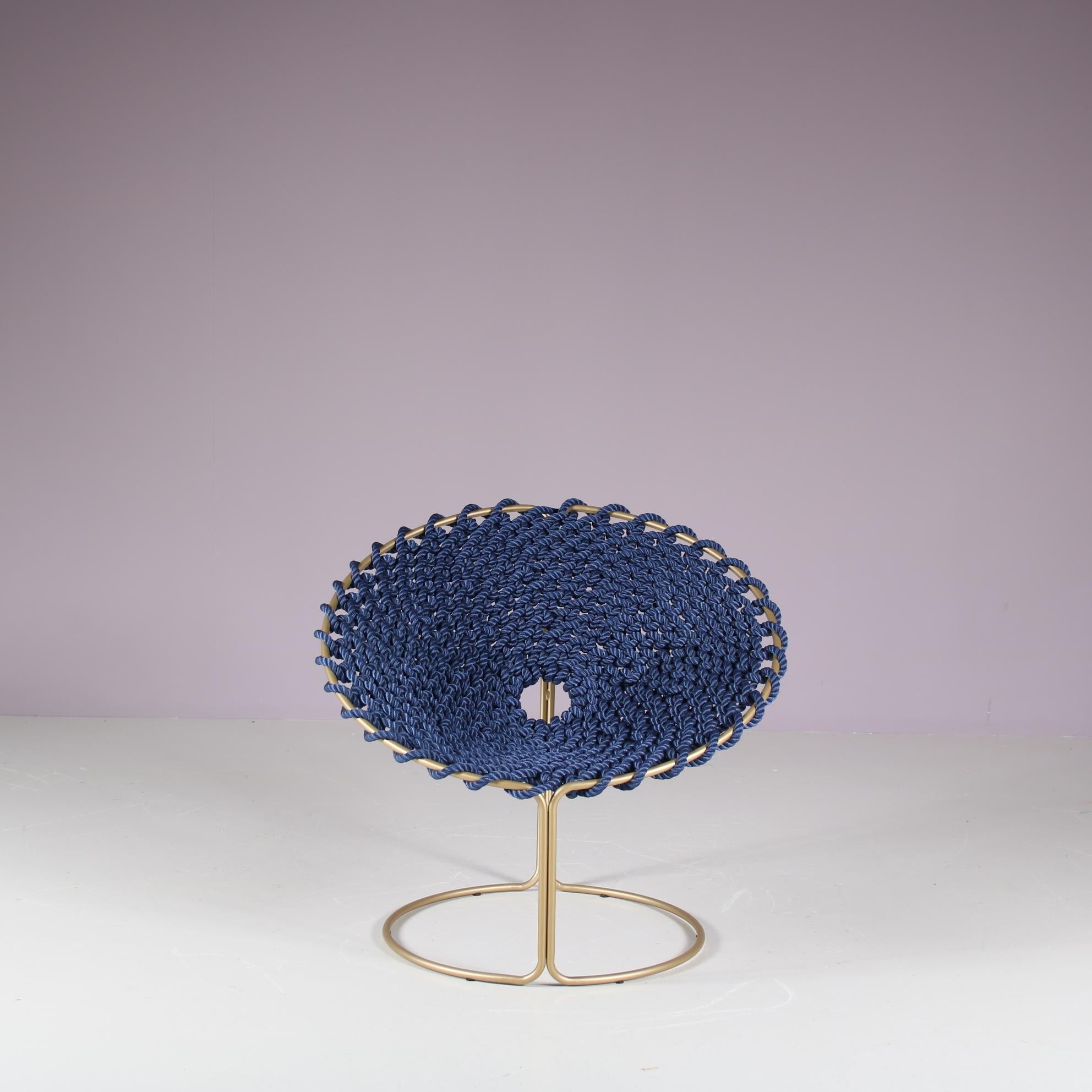 An eye-catching “Femme” chair, a 21st century design designed by Rik ten Velden, manufactured in the Netherlands.

As part of the maritime inspired “knotted collection”, this chair is made of thick purple knotted rope. The round seat is entirely