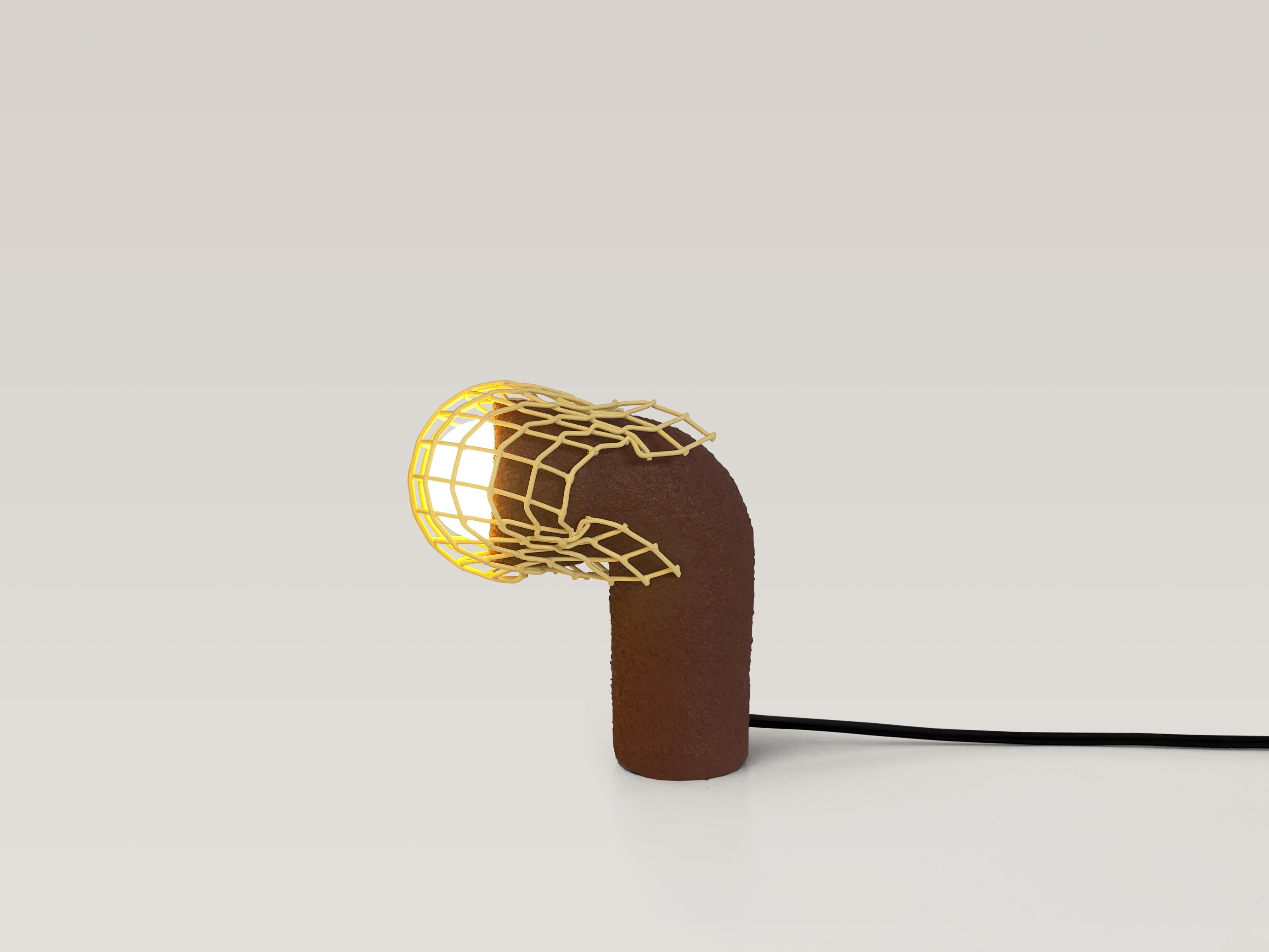 Small playful table lamp. Unique piece.

Material: clay, reclaimed metal, PVA, sand, acrylic paint, spray paint, pigment, polyurethane, electrical components, LED dimmable bulb.