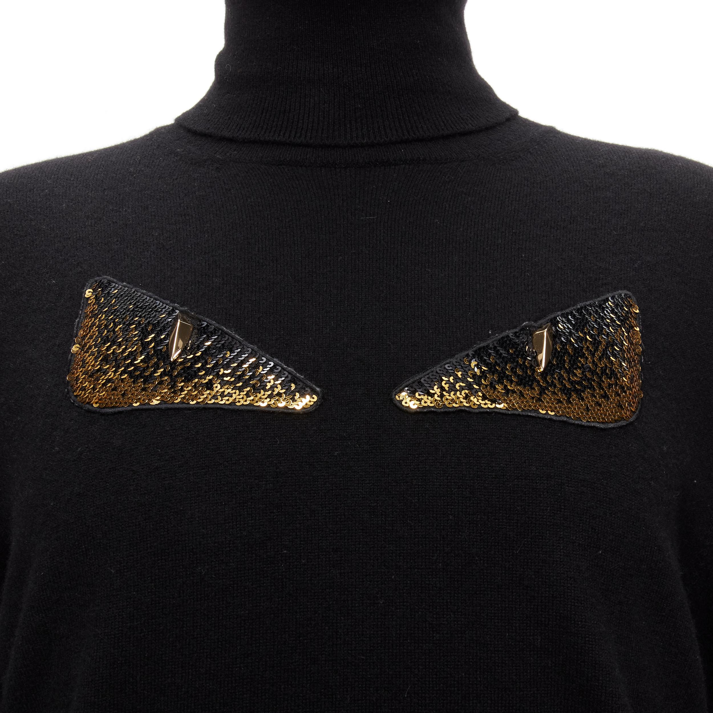 FENDI 100% cashmere black beaded stud Monster eyes turtleneck sweater IT50 L
Reference: TGAS/D00148
Brand: Fendi
Model: Monster
Material: Cashmere
Color: Black, Gold
Pattern: Solid
Closure: Pullover
Made in: Italy

CONDITION:
Condition: Excellent,