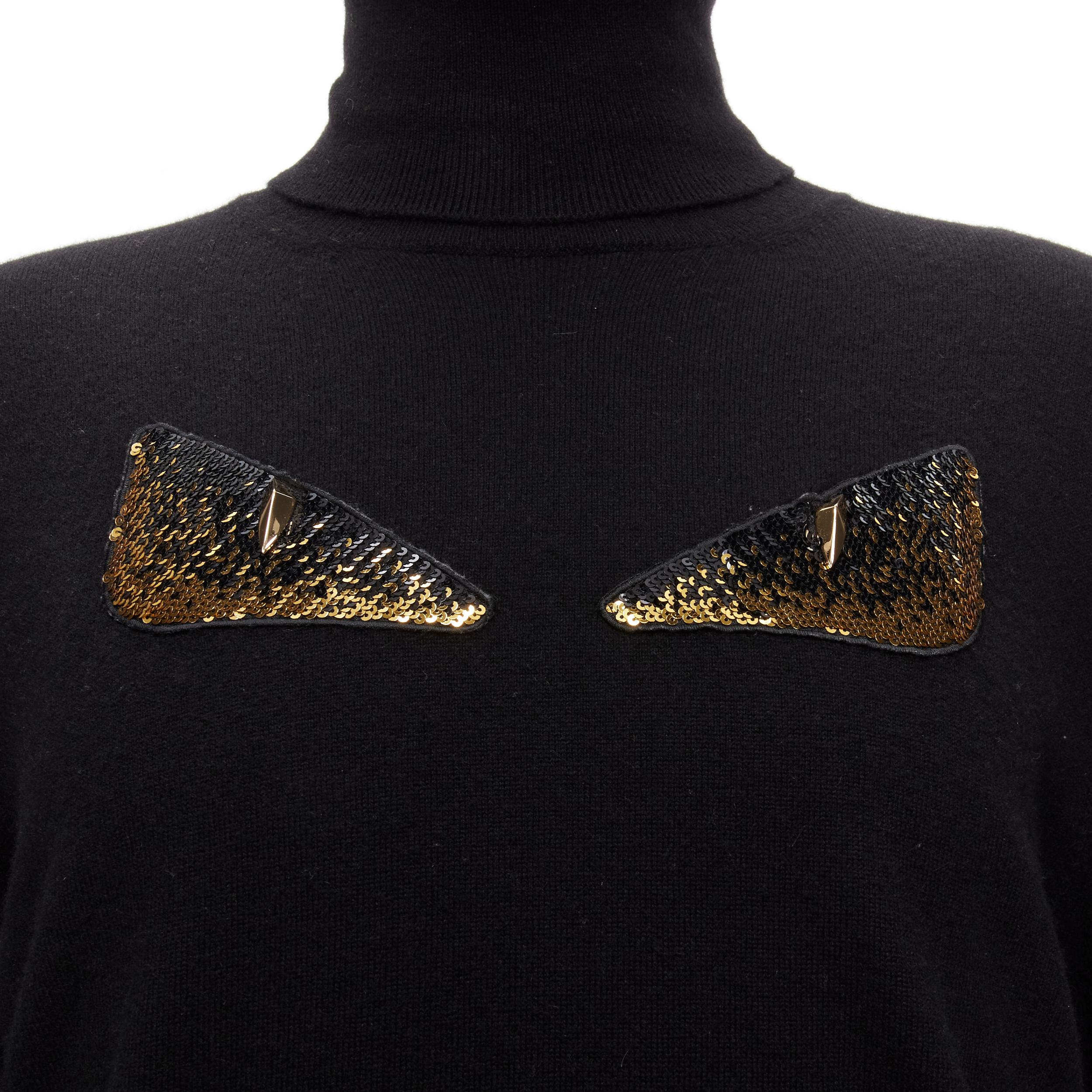 FENDI 100% cashmere black beaded stud Monster eyes turtleneck sweater  IT50 L
Reference: TGAS/D00148
Brand: Fendi
Model: Monster
Material: Cashmere
Color: Black, Gold
Pattern: Solid
Closure: Pullover
Made in: Italy

CONDITION:
Condition: Excellent,