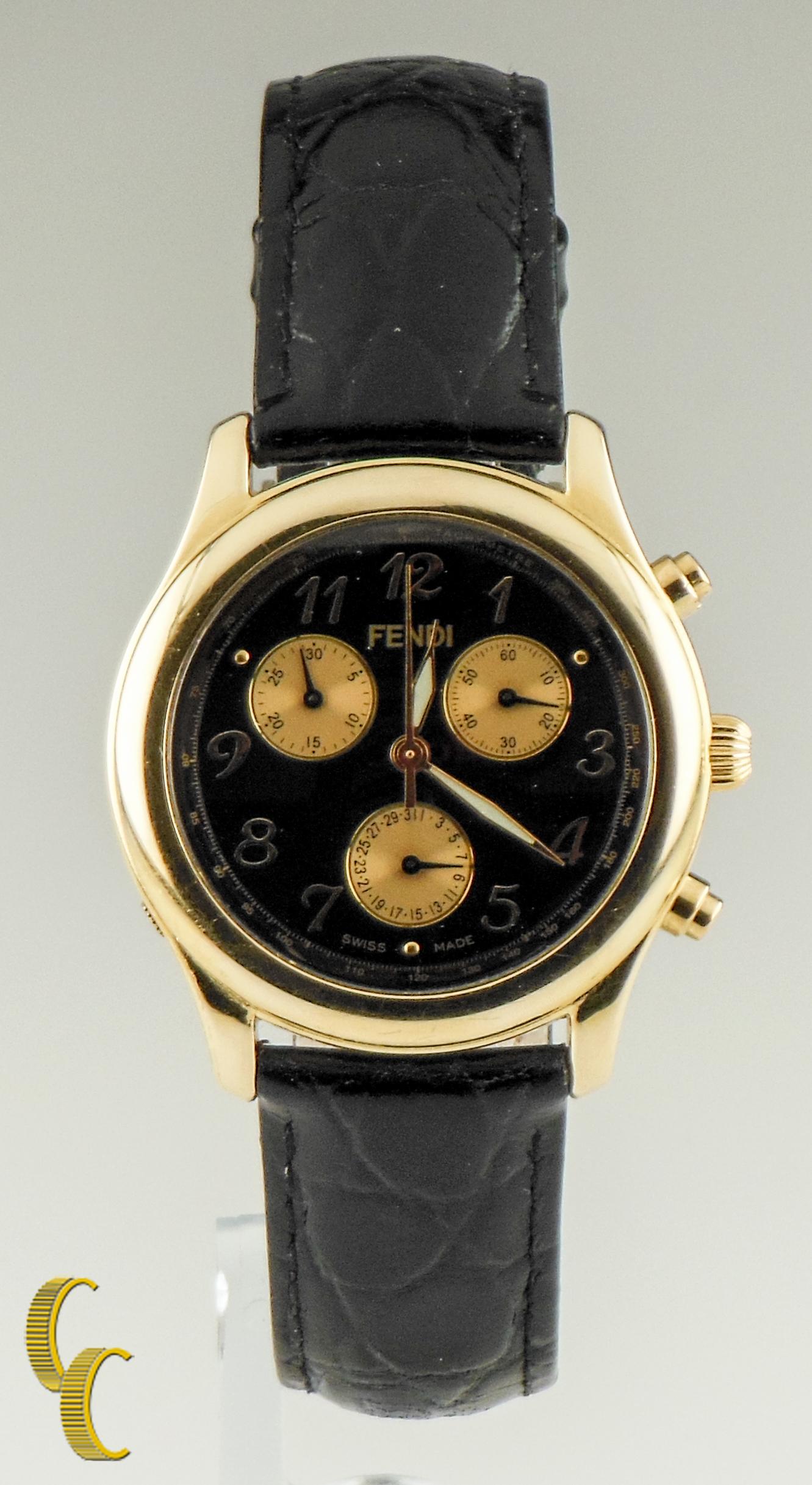 Fendi 18K Yellow Gold Chronograph Watch w/ Leather Band

Model: Chronograph
Serial #: 000-270-062

18K Yellow Gold Round Case
Case Size= 35mmmm 
Lug-to-Lug Distance = 40 mm
Thickness = 7 mm

Black Dial with Three Gold Subdials and Luminescent