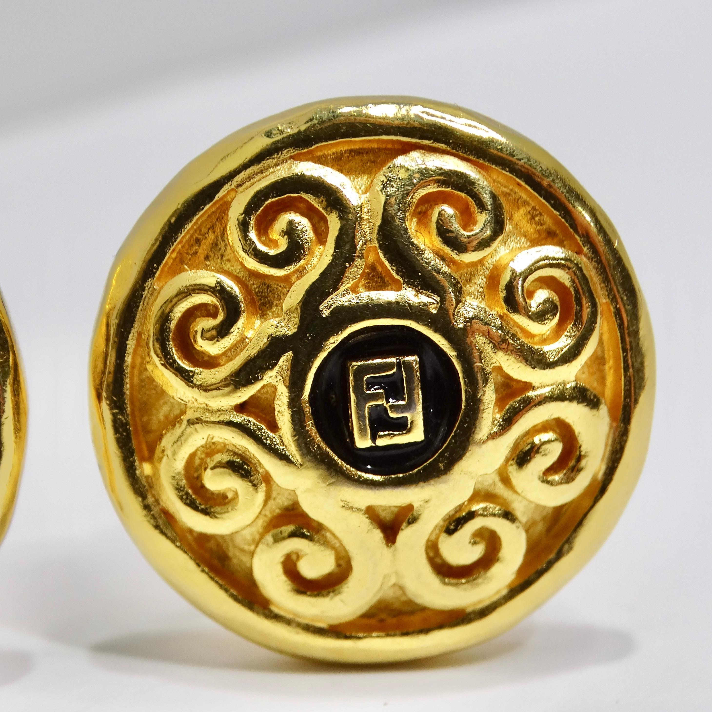 Do not miss out on the Fendi 1980s Gold Plated FF Clip-On Earrings—a timeless and chic pair that seamlessly combines vintage elegance with contemporary style. These round disc-shaped earrings feature a black signature Fendi FF logo at the center,