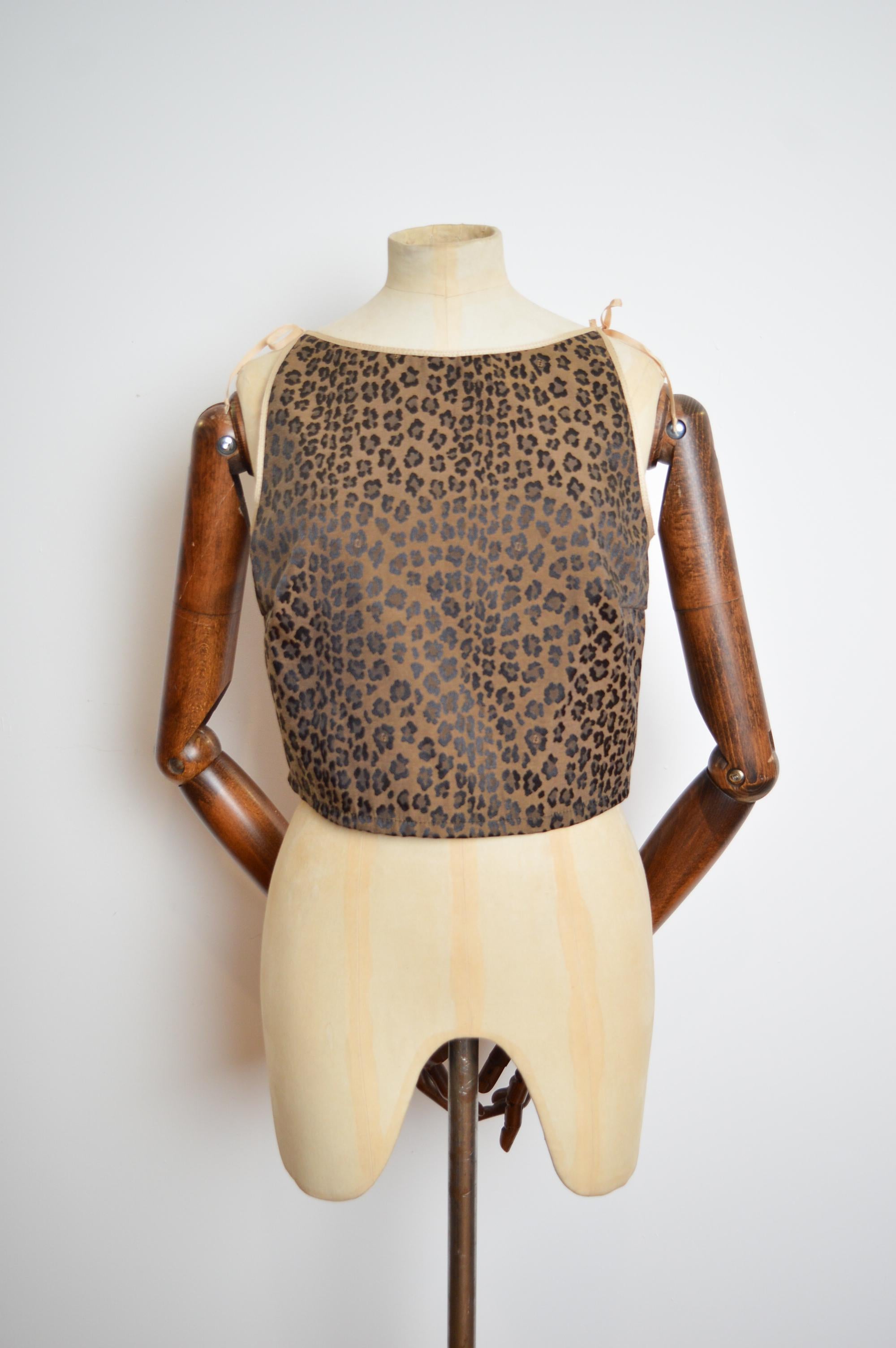 FENDI 1990s Leopard Pattern Zucca Corset Tank Top - Bustier 
MADE IN ITALY
CONCEALED SIDE ZIP
ADJUSTABLE SHOULDER STRAPS
Pit to Pit; 17”
Shoulder to Hem; 17.5” (approx shoulder straps are adjustable to ensure perfect fit)
Size; U.K. 8-10
Waist;