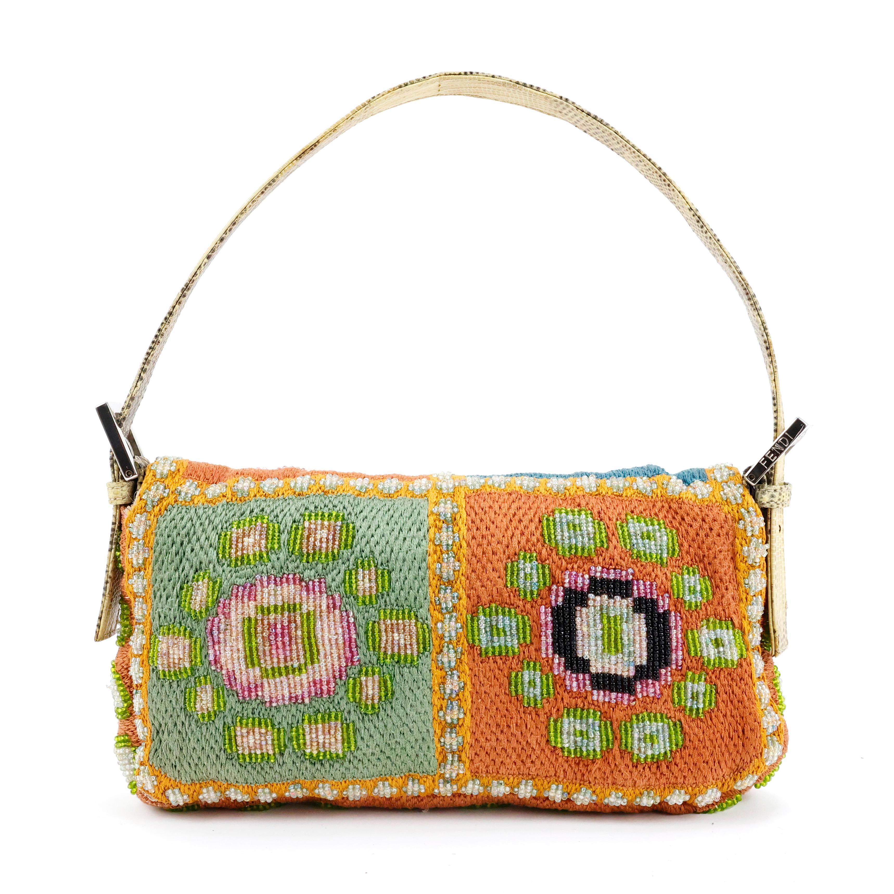 Fendi multicolor baguette bag all over crafted of embroidery and beads in many colors, with exotic (Lizard) leather. Silk satin interior color fucsia featuring one zippered pocket. 

Condition:
Really good. To note: slight discoloration on internal