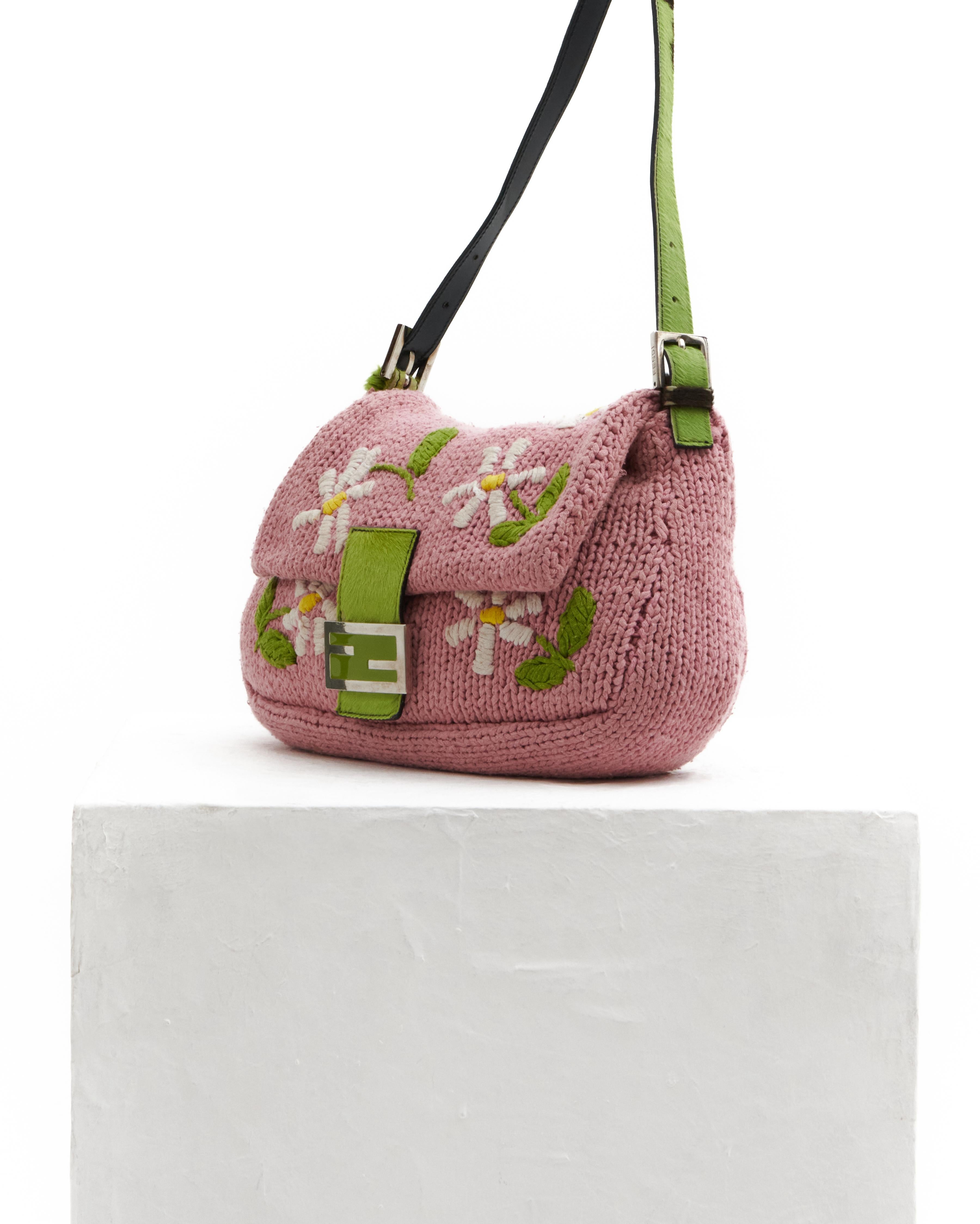 - Designed by Karl Lagerfeld 
- Sold by Skof.Archive
- From the 2000 Collection
- Pink knit floral embroidered cotton mama baguette
- Limited edition
- Silver-Tone Hardware
- Ponyhair Trim
- Single Adjustable Shoulder Strap
- Satin Lining & Single