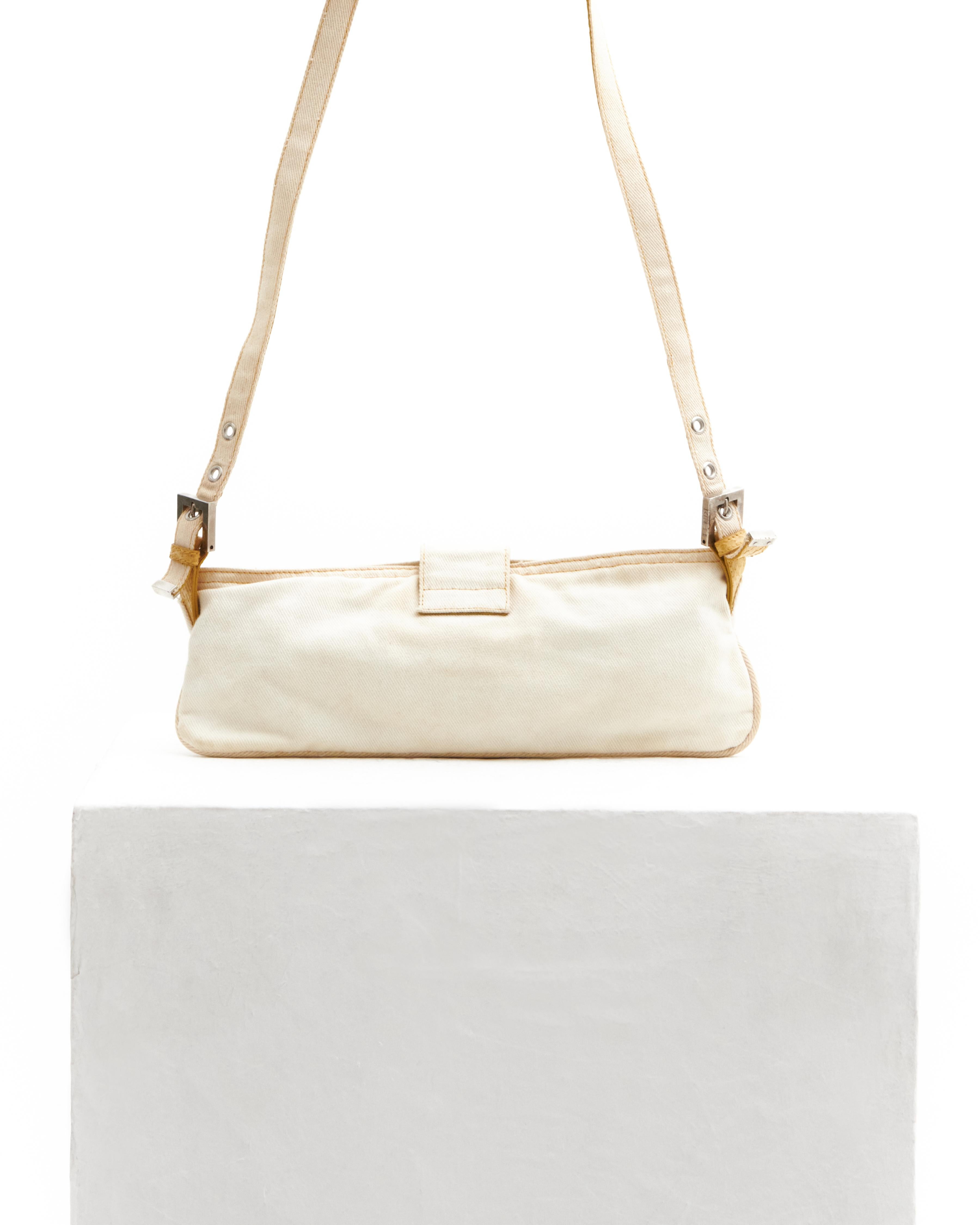 - Designed by Karl Lagerfeld 
- Sold by Skof.Archive 
- From the 2000 collection
- This bag features a cotton canvas body, silver-tone and total hardware 
- A single flat shoulder strap in beige snakeskin 
- Front logo flap closure in beige
