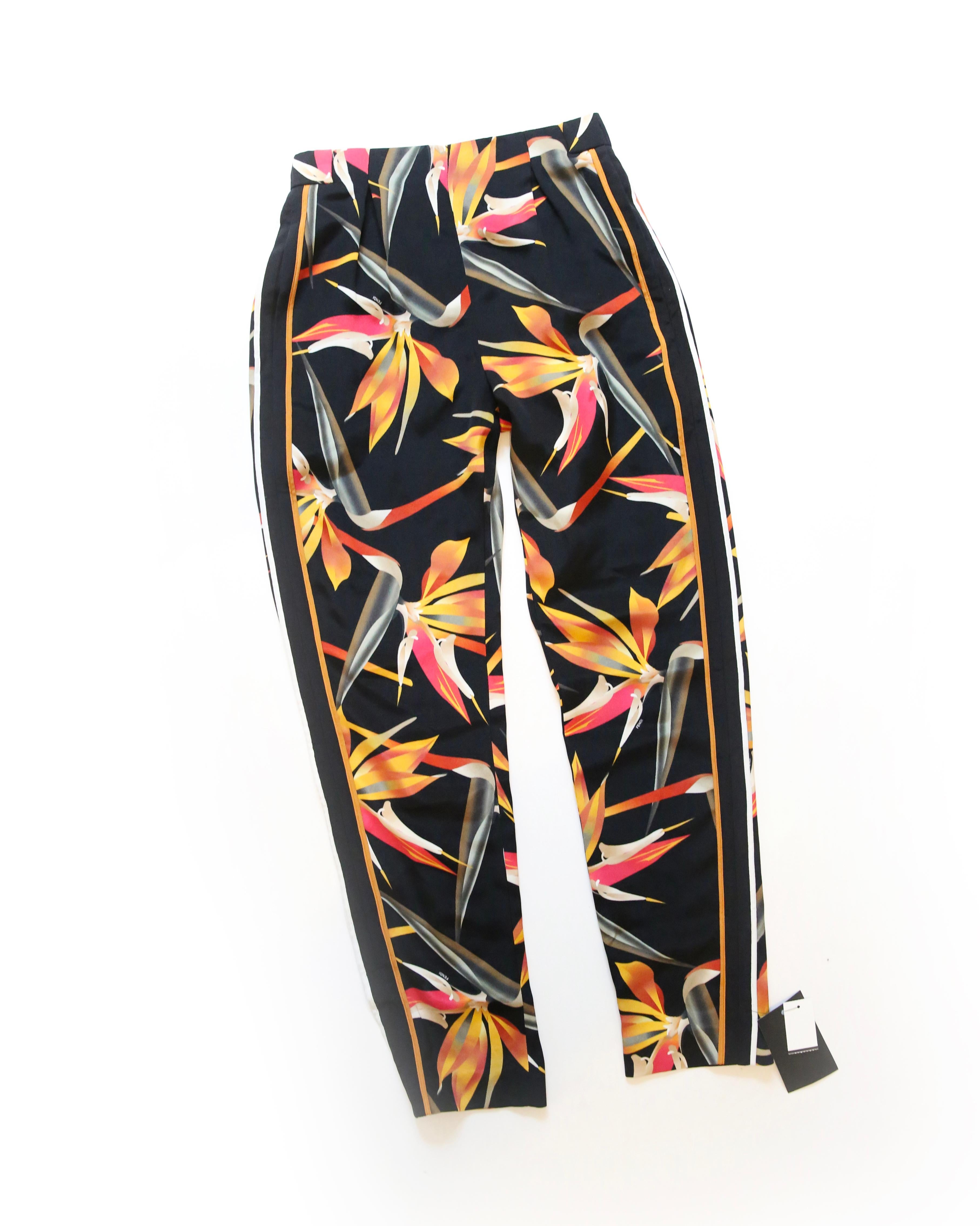 Fendi Resort 2016
Birds of paradise tapered silk stretch pants
Black with orange, yellow, red and white leaf style print
Stretch style pants that simply slip on
Designed for a loose fit to the leg

Composition:
100% Silk

Size:
IT 36

Brand new with