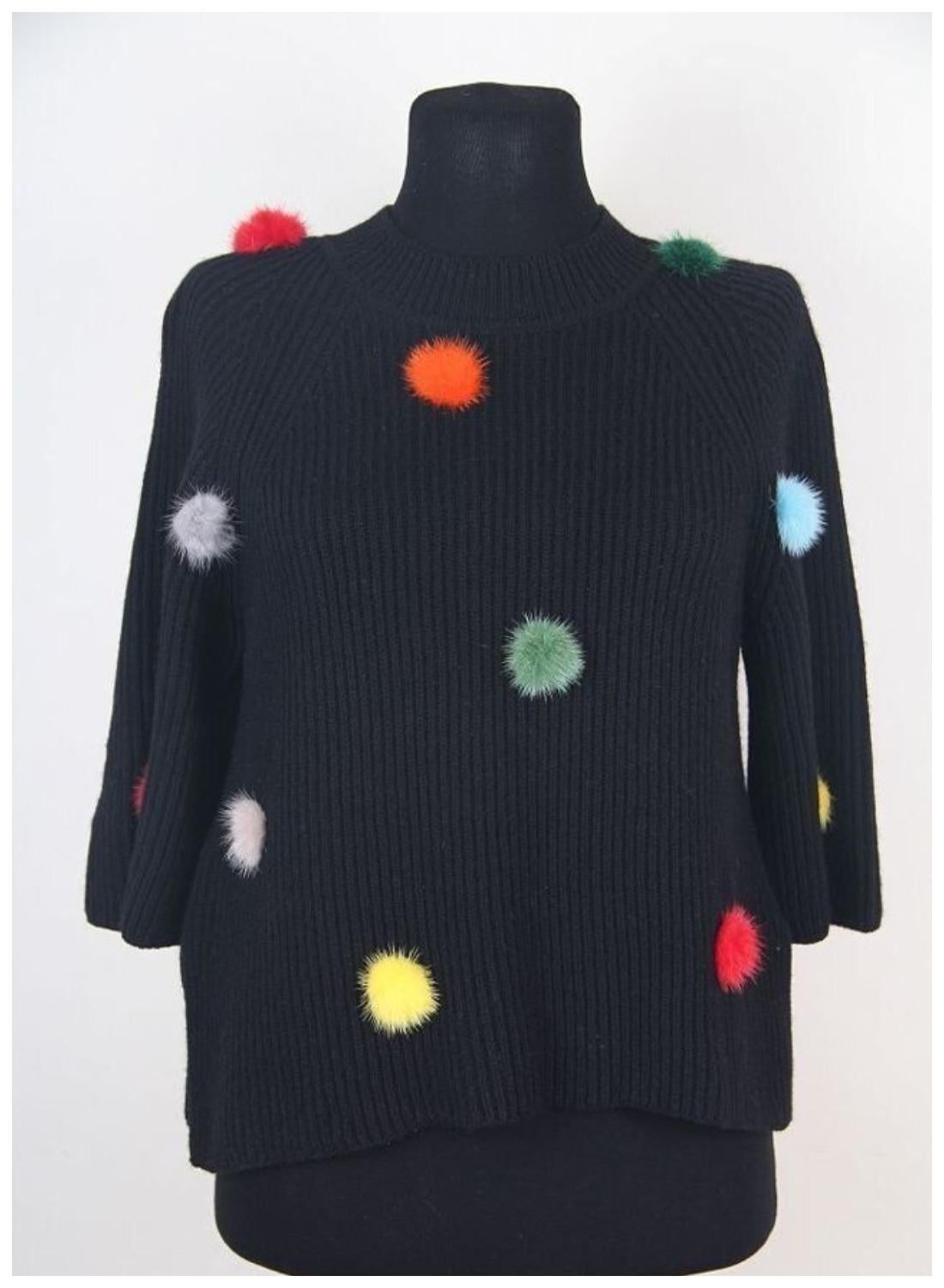 Fendi Black Cashmere Jumper with Mink Fur PomPoms US 2 

In the hands of Fendi, even the most classic things are reinterpreted. Take, for example, this black sweater; it's fitted, with a high collar and lots of rainbow-colored fur pom-poms on the