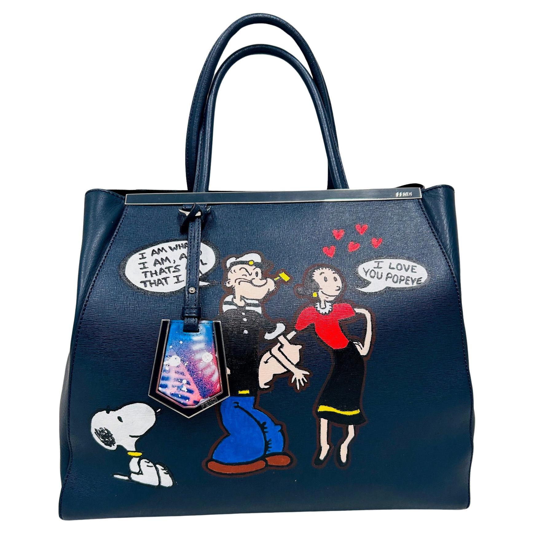 This is a one of a kind custom tote Fendi 2jour in navy blue. 
Textured durable leather on exterior and soft leather on the gussets.
The bag  was hand painted by pop artist Jeremy Wolff on both sides. 
Love the Popeye theme! 
The bag is in excellent