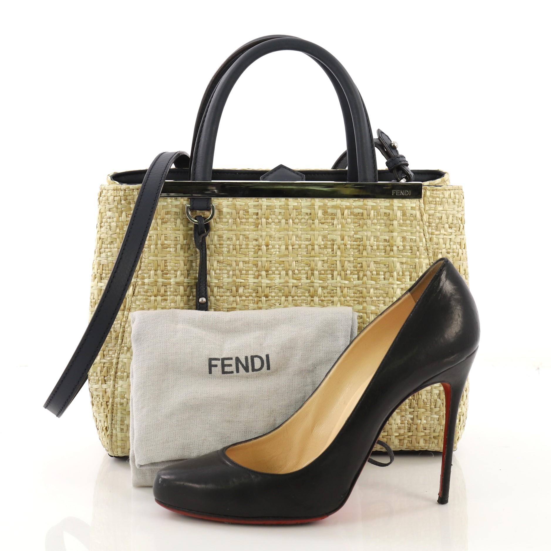 This Fendi 2Jours Handbag Straw Petite, crafted from beige straw, features dual rolled leather handles, top bar with Fendi brand name, and silver-tone hardware. Its snap tab closure opens to a navy fabric interior with a middle zip compartment.
