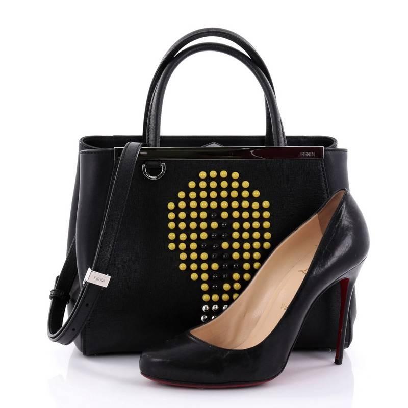 This authentic Fendi 2Jours Handbag Studded Leather Petite from 2017 collection will add a touch of fun to your wardrobe. Crafted in black leather, this unique bag features funky studs with lightbulb details, dual rolled-leather handles, protective
