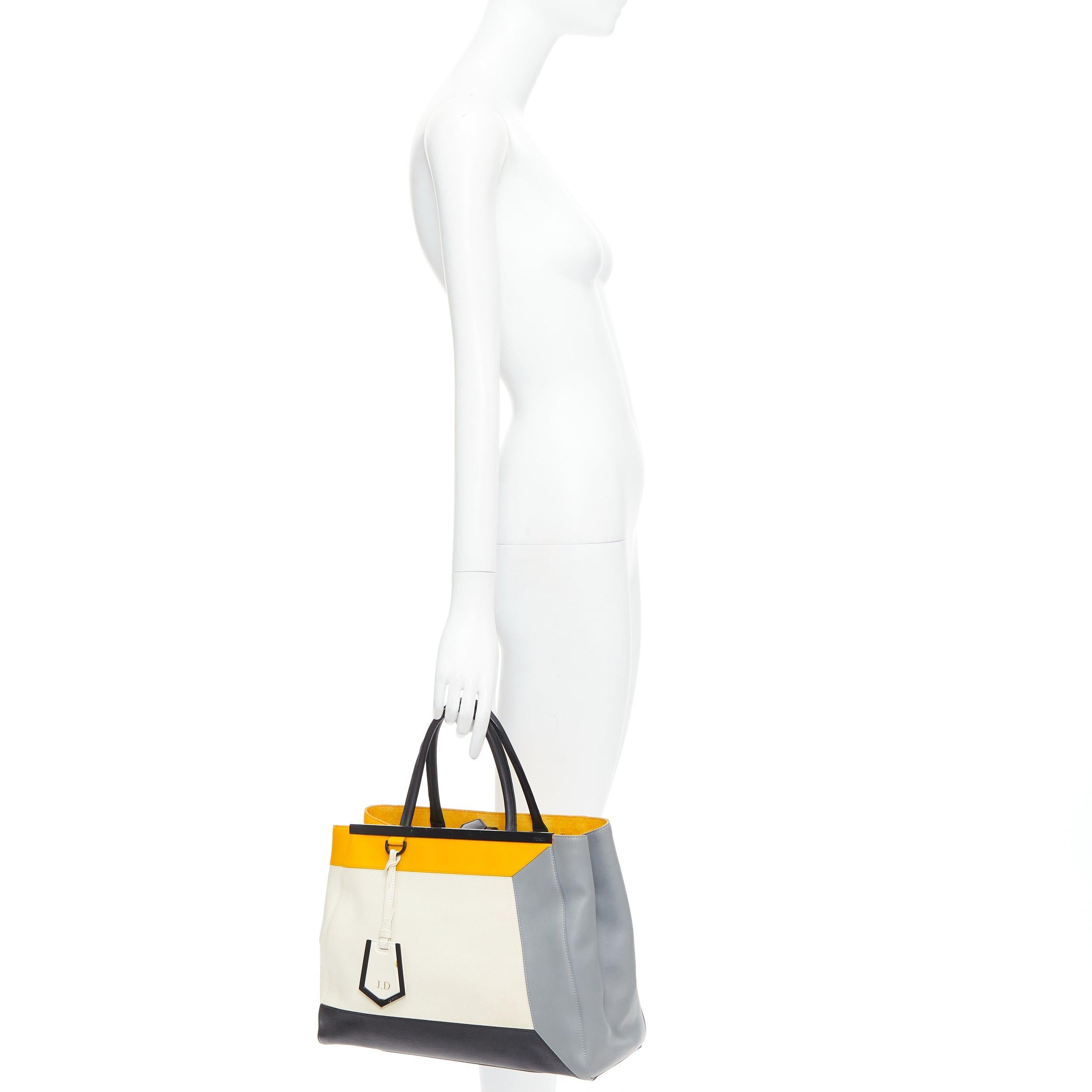 FENDI 2Jours yellow grey black leather tricolor colorblock tote bag
Reference: JHDN/A00002
Brand: Fendi
Model: 2Jours
Material: Leather
Color: Yellow, Grey
Pattern: Solid
Closure: Zip
Lining: Yellow Leather
Extra Details: From the 2013 Collection.