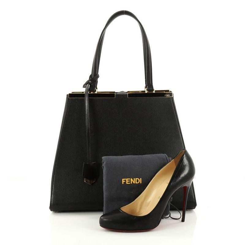 This authentic Fendi 3Jours Handbag Leather Large is impeccably stylish. Crafted in black leather, this minimalist tote features a shining split top bar that dons the Fendi brand name, tall leather handles, expandable side wings, protective base