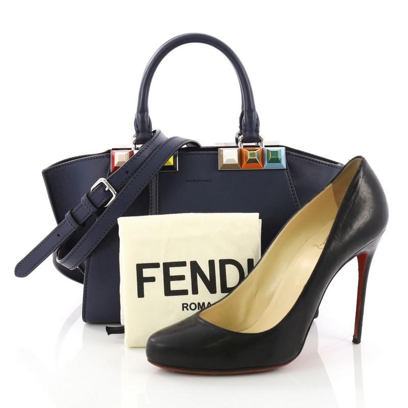 This Fendi 3Jours Handbag Studded Leather Mini, crafted from blue studded leather, features dual rolled leather handles, multicolor acrylic 'Rainbow' studs at throat, split top bar, and silver-tone hardware. Its top zip closure opens to a blue