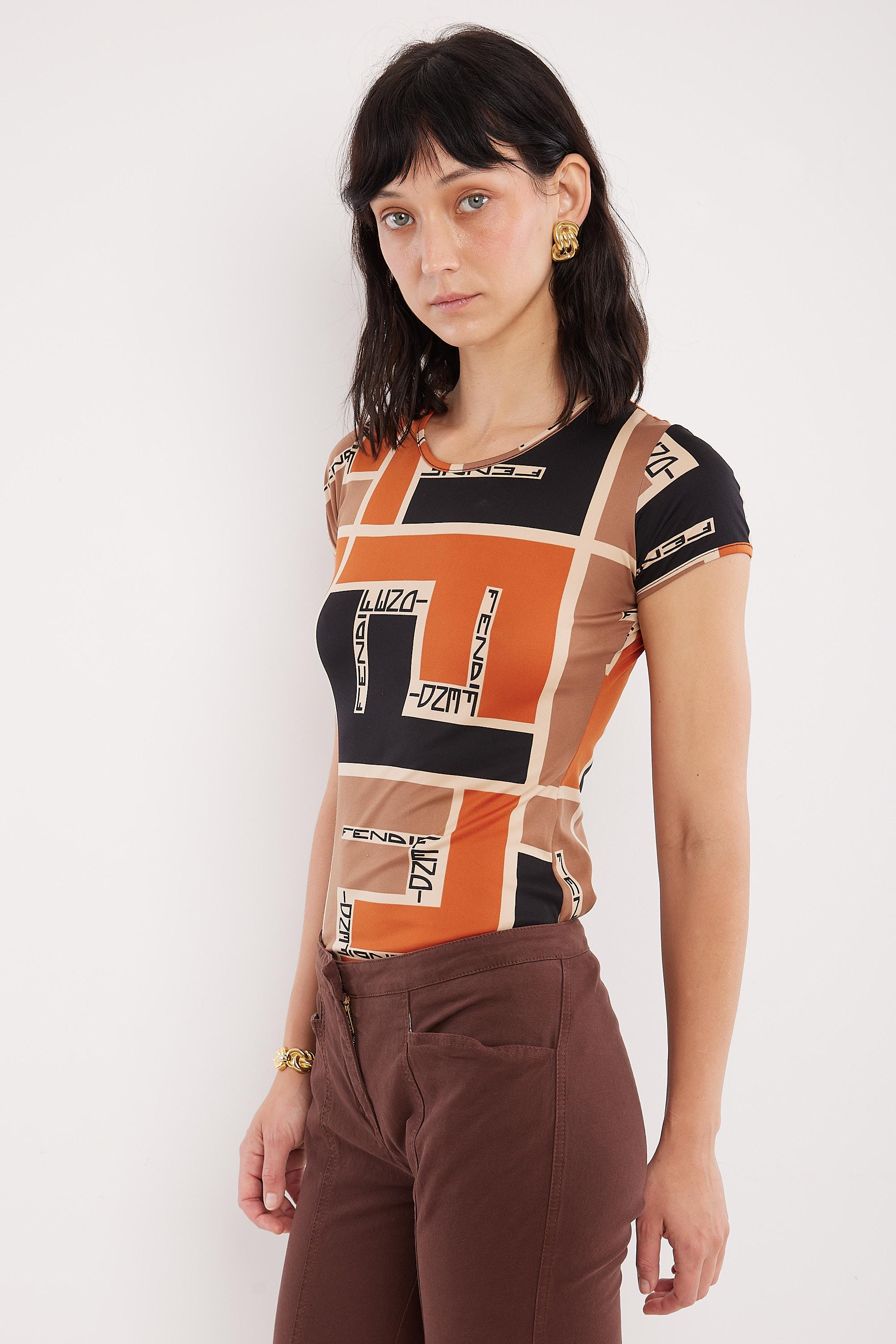 Dating to the 90's, this Fendi Mare top features a vintage inflected logo print that was recently revived by current Fendi creative director Kim Jones for the S/S 2024 collection. A classic crew neck t-shirt style with shrunken proportions, it is