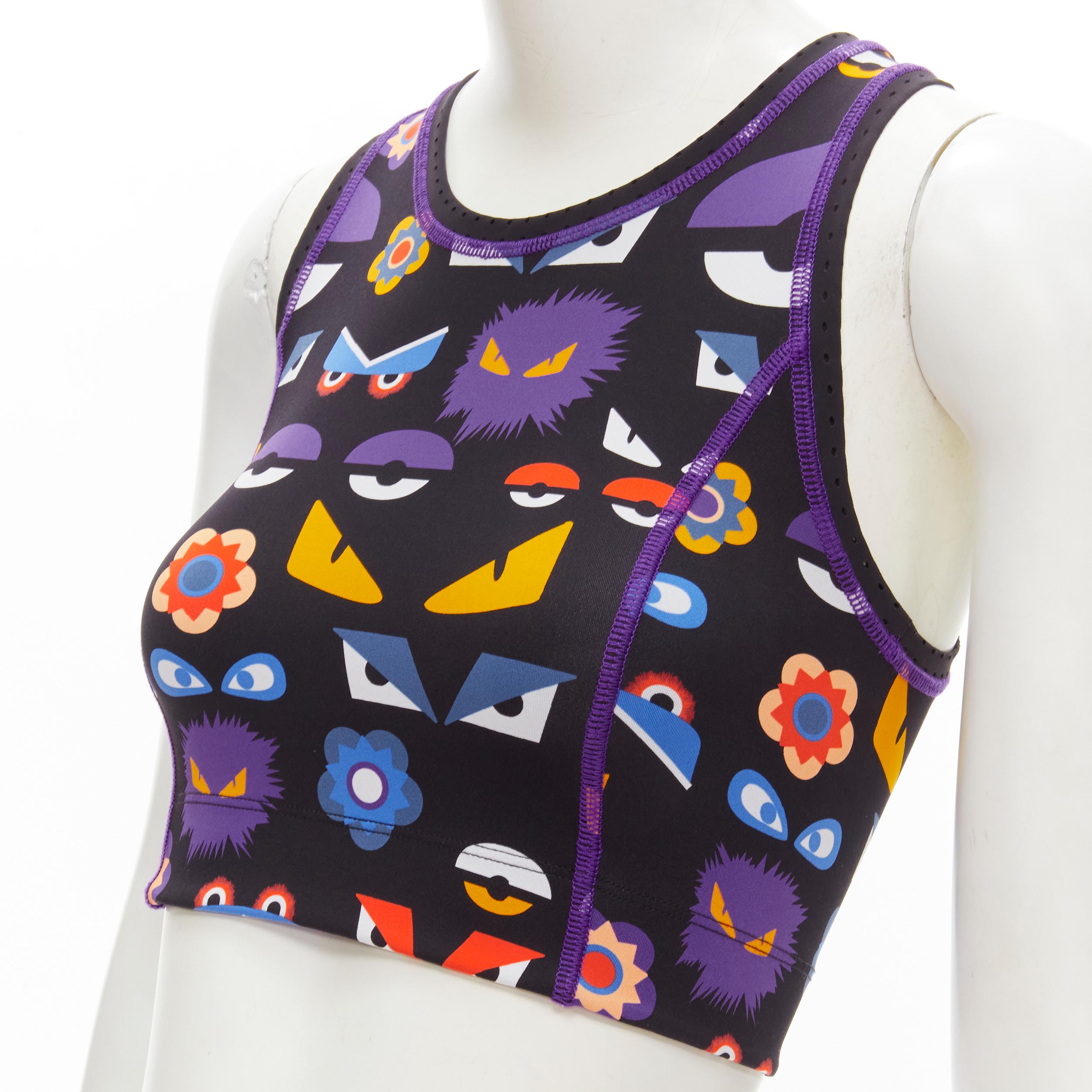 FENDI Activewear Monster Bug Eye black graphic print perforated crop top
Brand: Fendi
Material: Feels like polyester
Color: Black
Pattern: Graphic
Extra Detail: Purple overlock stitching. Perforated trim.

CONDITION:
Condition: Excellent, this item