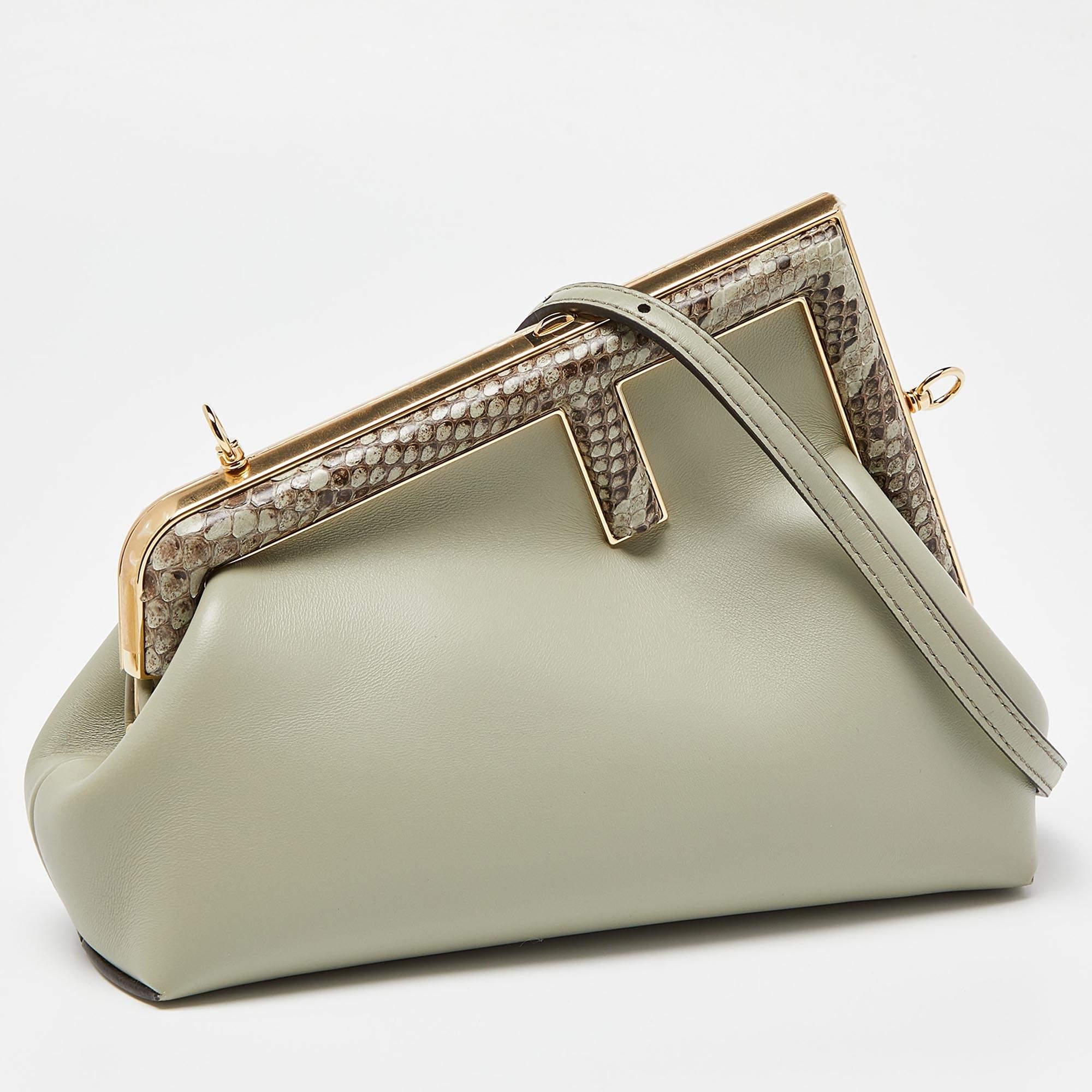 Invite the fashionable charm of the Fendi First clutch into your closet with this piece we have here. It is a small-sized First bag in beige leather and gold-tone hardware. The top F logo stands out beautifully, and the shoulder strap provides easy