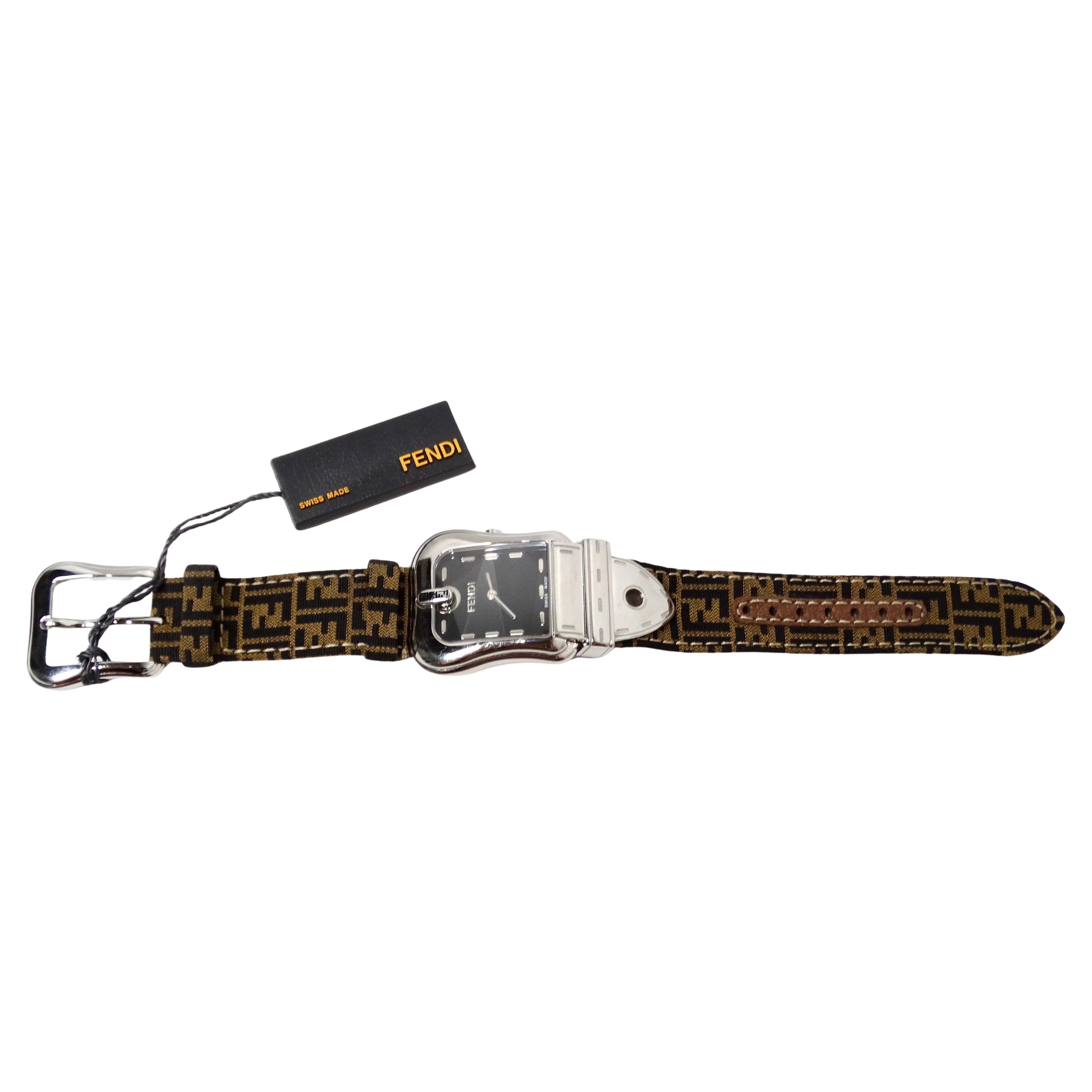 The Fendi B. Stainless Steel Zucca Canvas Wrist Watch is a sophisticated timepiece that embodies luxury and craftsmanship. Crafted with a durable stainless steel case, this watch features the iconic Fendi Zucca pattern on the canvas strap, which is
