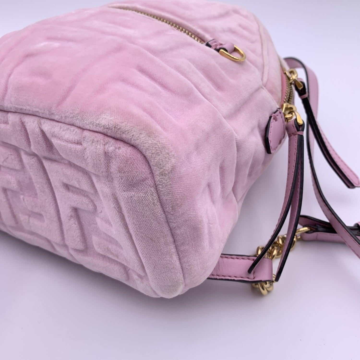 This beautiful Bag will come with a Certificate of Authenticity provided by Entrupy. The certificate will be provided at no further cost Gorgeous FENDI mini backpack carfted in pink velvet with embossed FF monogram pattern. Leather handles and