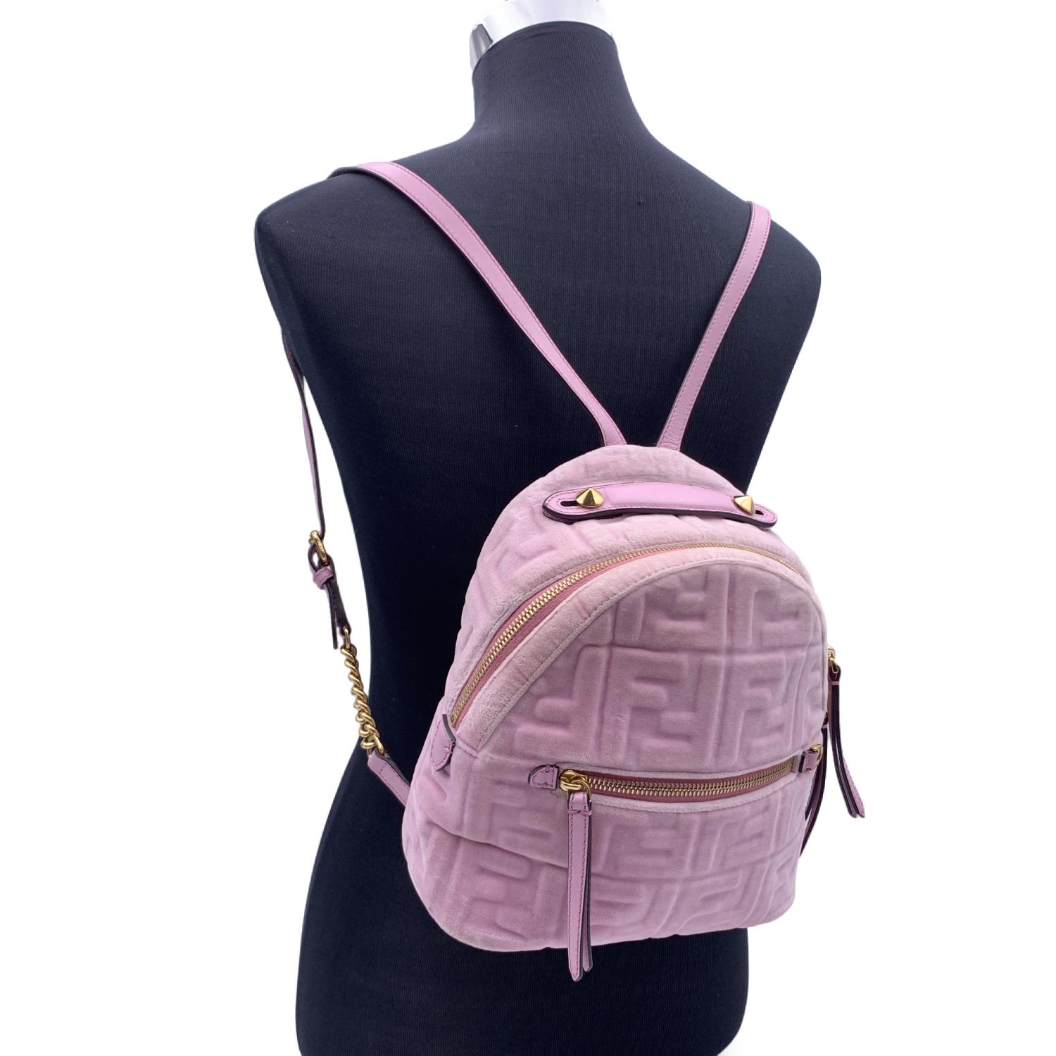 This beautiful Bag will come with a Certificate of Authenticity provided by Entrupy. The certificate will be provided at no further cost

Gorgeous FENDI mini backpack carfted in pink velvet with embossed FF monogram pattern. Leather handles and