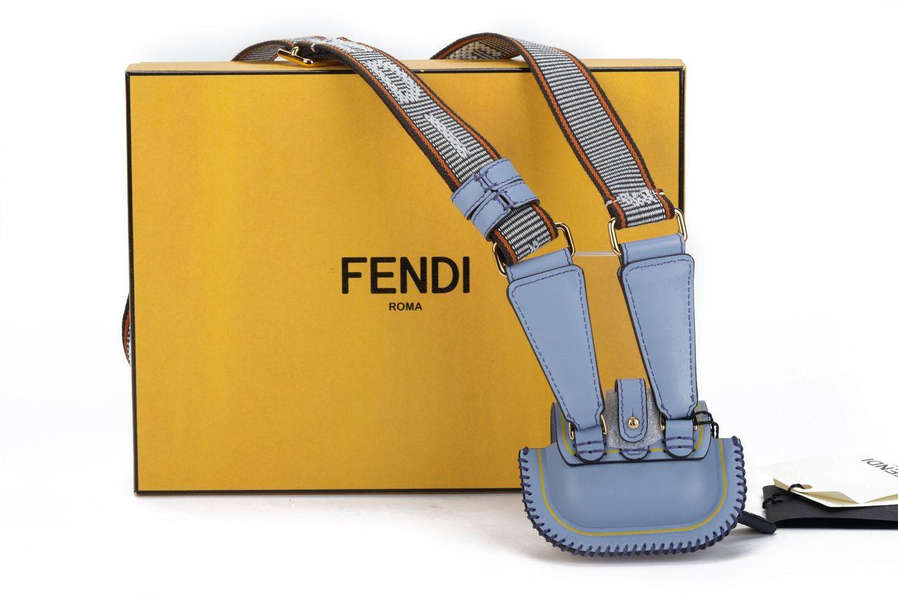 Fendi necklace bag crafted of leather in sky blue. The bag can be worn as a necklace or a shoulder bag with the adjustable strap (17