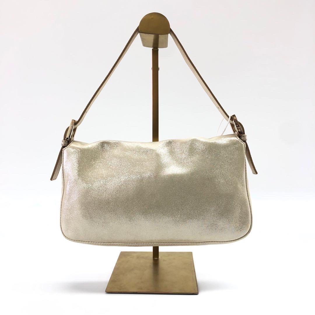 CONDITION: GOOD

This preloved / preowned authentic Fendi baguette has moderate stains throughout the bag. Rubbing around corners, and the edges of the flap. Cracks to the strap. Scratches to hardware. 

DETAILS

FENDI
Baguette
Material: