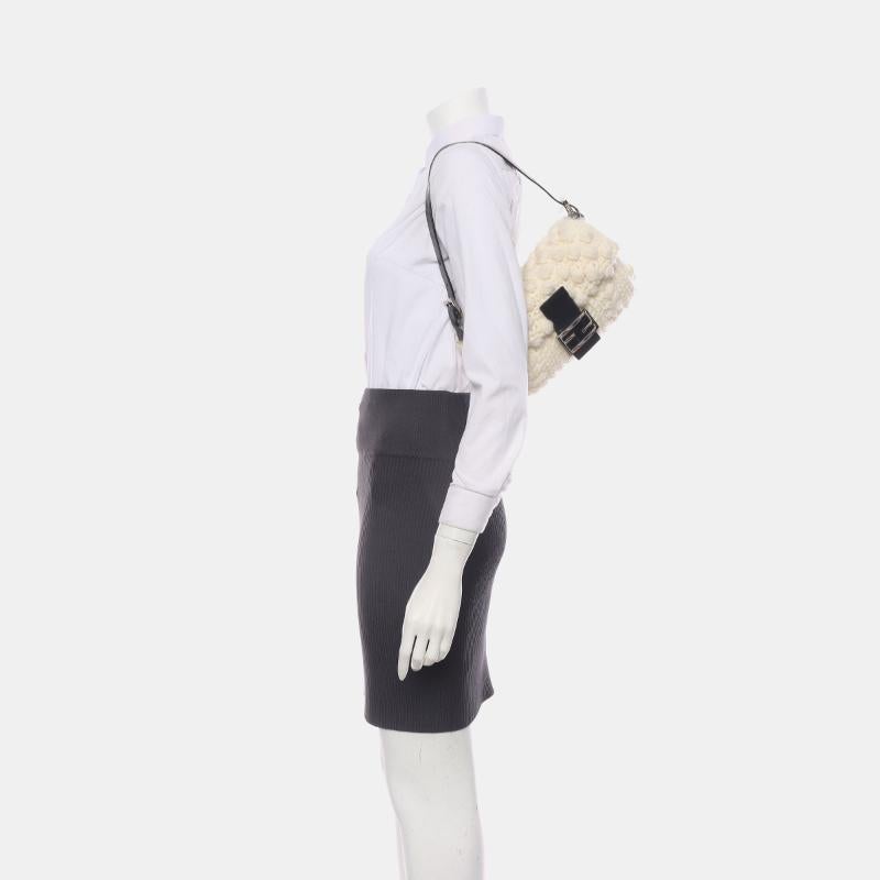 Fendi Baguette Bag White Crochet Knit Wool Pompom Shoulder Bag
 These are professional photos of the actual bag.
 CONDITION: ExcellentThis Fendi baguette bag has some light signs of wear, include stains on the exterior and interior. Scratches to the