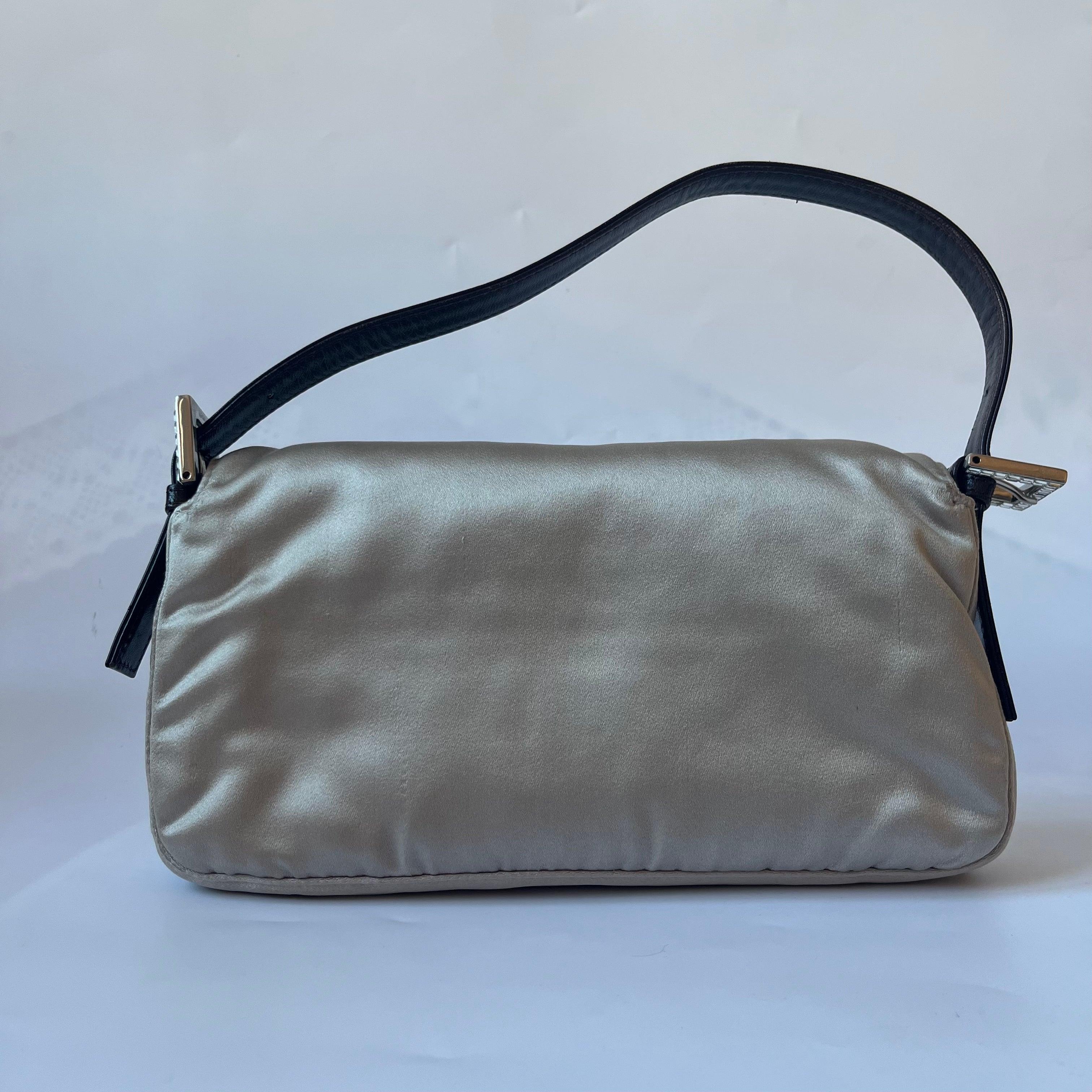 FENDI Baguette Beige Grey Silk Satin with Crystal Buckle Shoulder Bag
 These are professional photos of the actual bag.
 Introducing the timelessly elegant FENDI Baguette in Silk with Crystal Buckle! In very good condition, this classic piece is