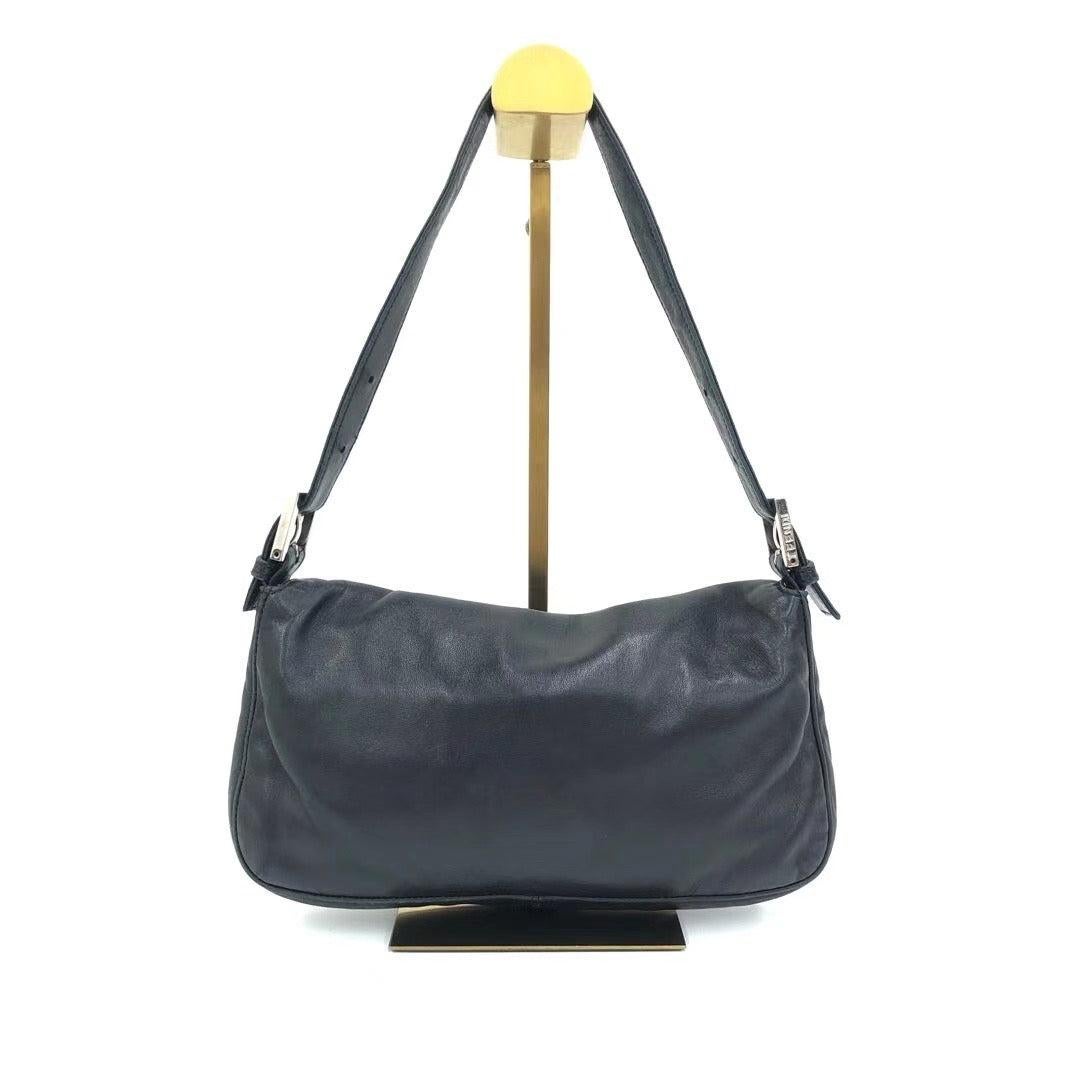 Fendi Baguette Black Lambskin Leather Shoulder Bag Green Enamel Buckle
These are professional photos of the actual bag offered by Luxbags.
Experience true luxury with the Fendi Baguette Shoulder Bag, featuring buttery soft lambskin leather and