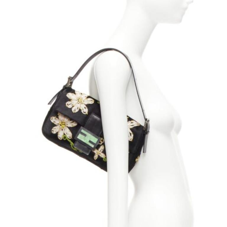 FENDI Baguette black pony hair FF logo buckle white embellished underarm bag
Reference: TGAS/D00976
Brand: Fendi
Model: Baguette
Material: Pony Hair, Leather, Metal
Color: Black, Multicolour
Pattern: Floral
Closure: Snap Buttons
Lining: Green